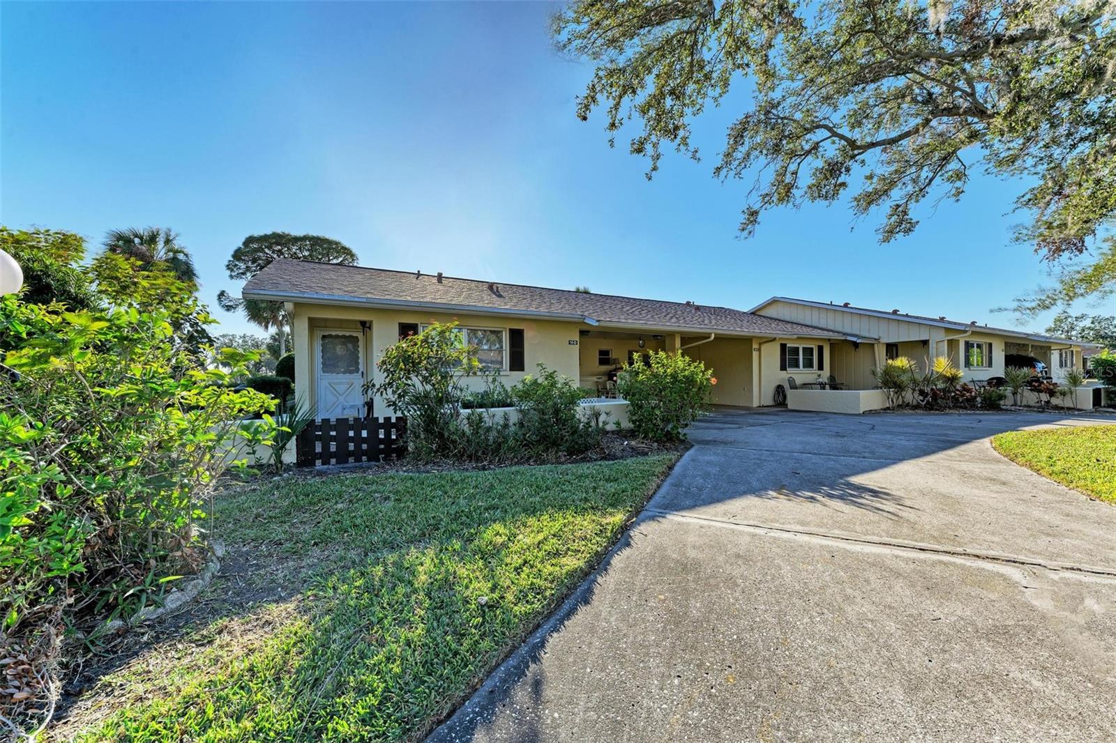 Welcome to this fully turnkey villa in the desirable Desoto Square Villas! Nestled in a beautifully maintained 55+ gated community, this charming 2-bedroom, 2-bathroom villa offers everything you need for stress-free living. The spacious layout includes a small dinette area that flows into the living space, making it perfect for casual dining or entertaining. Durable vinyl flooring runs throughout the home, with cozy carpet in both bedrooms. The master bedroom features a walk-in closet, en-suite bathroom, and an additional linen closet for extra storage. A covered carport provides a convenient storage area and a laundry closet with a washer and dryer, which stay with the home. The enclosed lanai offers a cozy retreat, ideal for morning coffee or quiet evenings. This community offers exceptional amenities, including a clubhouse, a heated community pool, pickleball and tennis courts, and a fitness center. Residents can enjoy fun activities like water aerobics, Tai Chi, book clubs, and pickleball/tennis groups. The HOA covers essential services such as roofs, water, sewer, trash, and lawn care ensuring a low-maintenance lifestyle. Please note, this is a pet-free community, with exceptions only for ESA or certified service animals. One owner must have a 700+ credit score as required by the HOA.