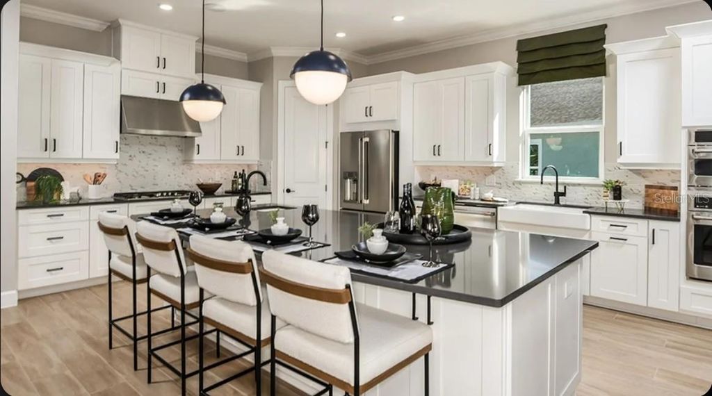 Photo of 1039 Tassleflower Trail, Saint Cloud, FL 34771 (MLS # O6428845)