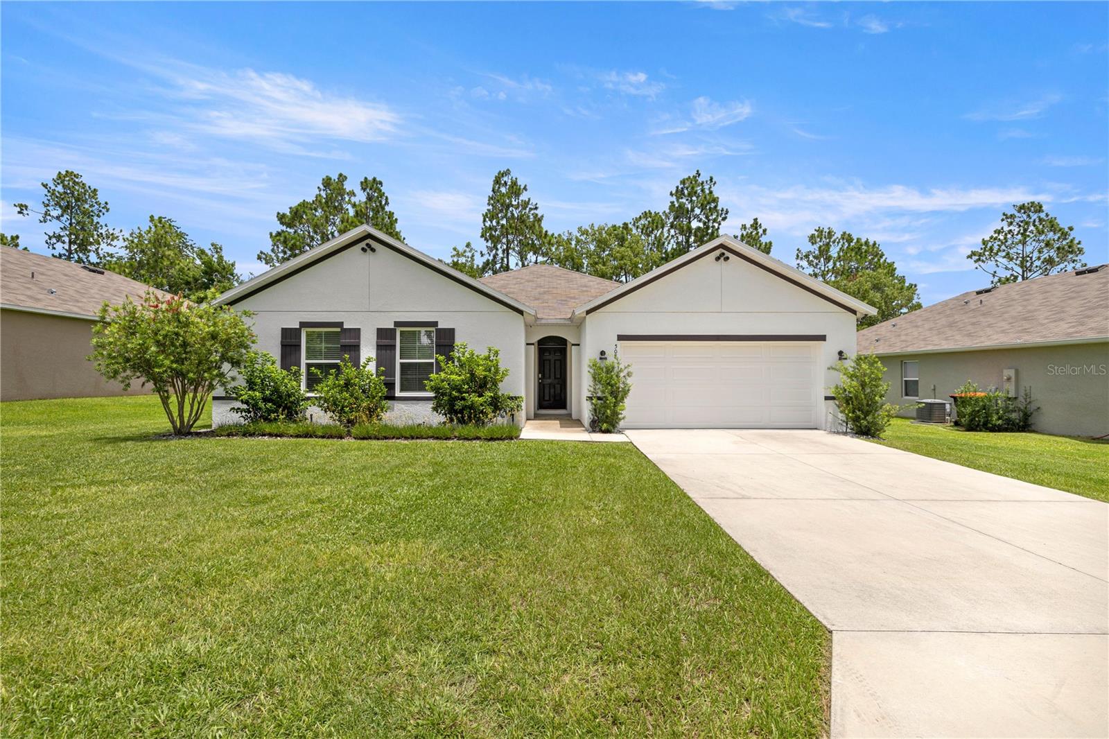 Stunning 4-bedroom, 2-bath split floor plan home in gated Lake Diamond, built in 2022 with 2,326 sq ft of modern living space. Backing directly onto the golf course, this home features granite counter-tops throughout, soft-close kitchen cabinets with slide-outs, a large stainless steel sink, glass shower doors in the master bath, and custom closet organizers in the master, pantry, and laundry room. Fully solar-powered with no electric bill, the system includes a solar water heater, battery backup compatibility, and a lifetime transferable warranty. Smart home upgrades include a Google Ring system, 4 mounted TVs (primary bedroom, living room, bedroom 2, and patio), and security cameras on all four corners with 24/7 recording. A 50-amp exterior plug is ready for an RV or EV. This energy-efficient, move-in-ready home offers luxury, technology, and peace of mind in one perfect package.