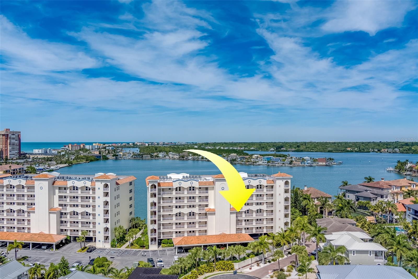Welcome to luxury living at its finest in the prestigious gated community of Redington Shores Yacht and Tennis Club. This stunning 3-bedroom, 3.5-bathroom condo offers over 3000 square feet of meticulously designed living space, ensuring comfort and elegance at every turn. Step into a fully furnished sanctuary where every detail has been thoughtfully curated, allowing you to simply unpack your bags and start enjoying resort-style living. Available from July 2025 through December 2025, this exquisite condo promises an extended vacation experience. The true split bedroom plan ensures privacy and tranquility, with an expansive master suite boasting a walk-in closet and ensuite bathroom overlooking the breathtaking blue waters of the bay. Relaxation awaits on the 45-foot covered balcony, where you can savor panoramic views and watch dolphins play. Entertain with ease in the spacious, open-concept kitchen and living areas, complete with a chef's delight kitchen featuring built-in convection oven, granite countertops, and stainless steel appliances. A generously sized furnished den offers the perfect retreat for unwinding with a book or enjoying a movie night. Redington Shores Yacht and Tennis Club provides residents with exclusive access to a wealth of amenities, including a clubhouse with fitness center, pickleball and tennis courts, and a clubhouse pool. Additionally, the building boasts a designated heated pool and hot tub overlooking the picturesque harbor, as well as a grilling area for enjoying poolside meals. 2 designated COVERED PARKING SPACES!! With the Gulf waters just a short walk away, you'll have easy access to pristine beaches, while restaurants, shopping, and vibrant beach life are all within close proximity. This condo truly embodies the feeling of home in a resort-like setting. Don't miss out on the opportunity to experience luxury living at its finest – schedule your appointment today.