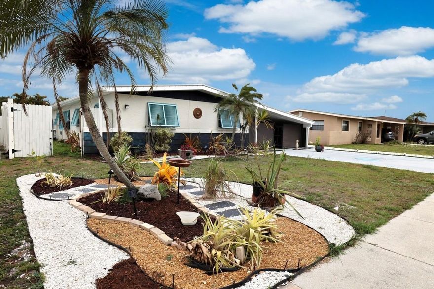 One or more photo(s) has been virtually staged. Spacious and beautifully updated 5-bedroom, 2-bath pool home in the heart of Sarasota—offering no deed restrictions, no HOA, and no flood insurance required.

This fully rehabbed home welcomes you with a bright living room featuring stunning designer metallic flooring. The flexible 5th bedroom is currently used as a home office, perfect for today’s lifestyle. Major updates include a metal roof (2012) and new HVAC system (2025) for peace of mind.

The kitchen shines with new appliances, designer-added storage units, and a striking palm frond tile backsplash, creating both style and functionality. The dining room features a built-in closet with a charming barn door closure.

Enjoy added convenience with an indoor laundry room equipped with a tankless water heater. The home is fully fenced for privacy and includes ample outdoor storage, along with new shutters throughout for enhanced curb appeal.

Step outside to your private pool area—ideal for relaxing or entertaining.

This home is being sold partially furnished, making it move-in ready or a great investment opportunity.

Centrally located near the interstate, hospitals, medical facilities, shopping, and a wide variety of dining options.

A rare opportunity to own a 5-bedroom pool home in Sarasota priced below market—don’t miss it!