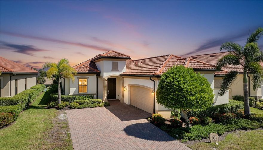 Welcome to your next home! This elegant side load Victoria model in Sarasota National, Venice's premier gated golf community, is truly a "must see," offering both sophistication and comfort in an exceptional setting. The open concept design with high ceilings creates a bright, airy atmosphere and features two bedrooms and a FLEX Room, thoughtfully designed to serve as a guest bedroom or as a cozy TV room. The home includes two full and one half bathrooms, with the convenient half bath located just off the extended lanai for easy outdoor access. The covered lanai is a standout feature, boasting a highly desired panoramic screen with picturesque views of the scenic 5th fairway. The lanai also features City Stone luxury pavers, a Hot Spring Spa,upgraded ceiling fans, and beautiful outdoor kitchen. This inviting space is perfect for entertaining guests, unwinding in comfort, or simply taking in the serene surroundings. If you want to live the indoor/outdoor lifestyle, simply open the impressive 8-foot-high by 12-foot-wide sliding doors and start living your best life. This smart home has many upgrades including 8 foot doors throughout, numerous rooms feature TRAY CEILINGS and CROWN MOULDING,  ROUNDED INTERIOR WALL CORNERS, PLANK TILE FLOORS, CEILING FANS in all rooms, wood shelving in all closets, and upgraded lighting fixtures that elevate every space. The kitchen is beautifully appointed with GE PROFILE stainless steel appliances, 42 inch upper cabinets featuring under counter lighting, an executive kitchen package with a microwave/oven combo wall unit and drop in cook-top, elegant quartz countertops and backsplash, and an expansive pantry that provides ample storage. The primary suite is the perfect place to rest and offers a convenient slider to the lanai.  Throughout the home, you will also notice the upgraded PLANTATION SHUTTERS which add both charm and functionality. This storm ready house with impact windows is located in a no flood zone, offering peace of mind, and must be seen to be fully appreciated. Included in your HOA fees are TWO UNLIMITED GOLF MEMBERSHIPS to Sarasota National’s 18-hole championship golf course, representing an exceptional value. Residents also enjoy full access to the impressive 30,000 square foot palm club community. The incredible amenities center includes a recreational resort style pool with lap lanes, a separate hot tub, poolside full-service tiki bar, an on-site restaurant, and the ever-popular 19th hole bar/restaurant. Additional amenities include multiple game rooms, a coffee lounge with library, a dog park for both big and little dogs, a playground, multiple pickleball courts, tennis courts, and bocce courts. A full-time activity staff coordinator is available to help you take advantage of the many opportunities for recreation, socializing, and relaxation. Sarasota National is ideally located just minutes from the exciting Wellen Park, a thriving destination filled with terrific restaurants, outdoor vendors, and entertainment. It is also in close proximity to multiple beaches, downtown Venice, and CoolToday Park, the home of the Atlanta Braves. The location offers both convenience and a peaceful sanctuary when desired and most of all, Sarasota National is known for its incredible atmosphere, lively social environment, and soon-to-be incredible Championship level golf experience. Make this home and Sarasota National your next home by reaching out today!