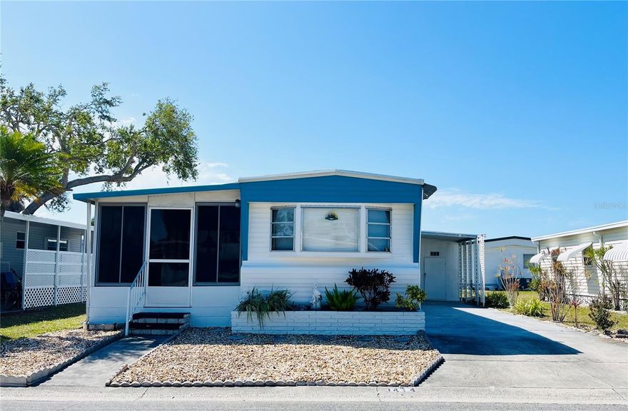 Welcome to this turnkey furnished light and brightly renovated open concept Florida inspired 2 bed 1 bath home. Located in a very active community inside the ONLY Resident Owned Park in the City limits of Sarasota!!
An entry door has been added to enter into the main part of the home, the entire inside (except the guest bedroom) has been insulated and drywalled. The living, dining area and bath have been updated to luxury vinyl plank flooring. The hall and bedrooms have vinyl flooring. The living room has a large front bay window, is fully furnished including a flat screen TV and has updated sliders leading to the lanai. The kitchen has been renovated in 2023 with soft close cabinets, the pantry, counters, backsplash, stainless farm sink and the stainless appliances were installed 4/2023. The dining area provides a table with seating space, a server and is open to the kitchen and living areas. The primary bedroom has a queen bed with a double wardrobe 2 dressers and nightstands. The guest bedroom has a daybed inspired trundle pull out that provides additional sleeping space and a desk space. The bath has been updated with the luxury vinyl flooring, higher vanity/sink with plenty of storage, a walk in shower and updated stool. Enter the lanai from the living room sliders or the front screen door to the street. This 200sf additional living/dining space faces East allowing for morning sun and shaded in the afternoons. The lanai updates include having vinyl windows installed in 2020 by AMS and adding tile flooring over the concrete. Home is being sold turnkey furnished including the gas grill and bikes.  Please note a few personal items will not convey with sale.
Update/notes: AMS Roof Over 2015, Vinyl siding added 2019, Siemens Electrical panel 2019, HVAC 2012, Windows updated 2017-2020, Vapor barrier 2016, Sewer line 2018, Water Heater moved to shed and replaced 2019 with 40gal, plumbing is copper with shut offs. Washer Dryer both 2019.  Note: The Association will require the Buyer to have a carport replaced.
The gated 90 acre community boasts a low maintenance fee with its vast amenities starting with the spacious Clubhouse outfitted with a full commercial cook kitchen, event stage, audio/visual, dance floor, state of the art fitness room, activities hall, library with books/movies/puzzles and a pool table. Outside recreation includes an extra large heated pool with a handicap ramp, a spacious kidney shaped hot tub, ample umbrella tables and lounge chairs and updated shower rooms. Oak trees shade the beautiful park area, picnic tables and a community grill. Additional amenities to enjoy are the community putt putt course, bocce ball, ping pong, horseshoes and corn hole. Oakwood Manor is a vibrant community with numerous social events and activities. Conveniently located adjacent to Legacy Trail and 12 newer pickle ball courts. Just a short drive to our crystal sand beaches, downtown area, the marina, fishing pier, local golf courses, shopping, variety of restaurants, the museum, SRQ airport, SMH and Doctors hospitals. Please note that Oakwood is a 55+, no pet, no motorcycle Park.