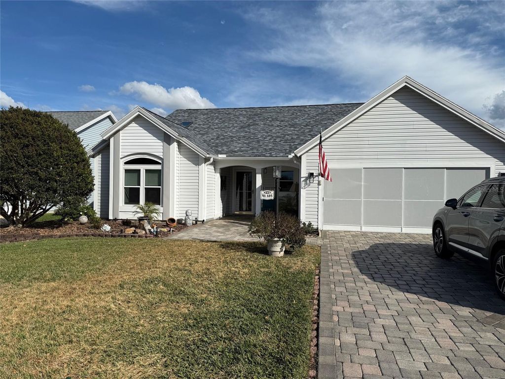 Photo of 725 Palma Drive, Lady Lake, FL 32159 (MLS # OM717561)