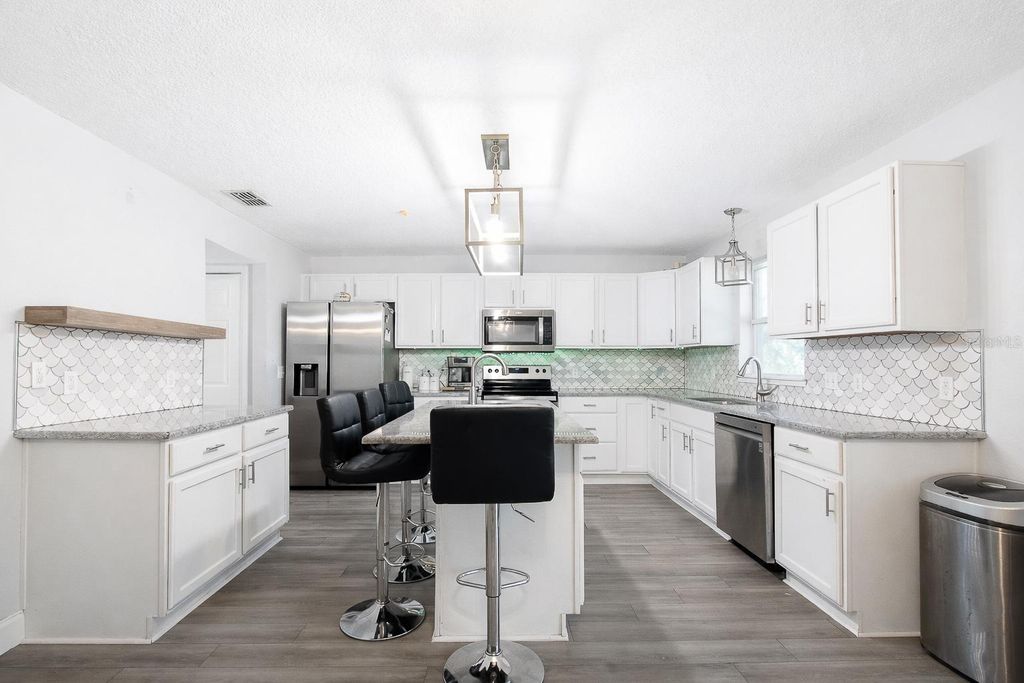 Photo of 1033 Tawny Eagle Drive, Groveland, FL 34736 (MLS # G5106504)