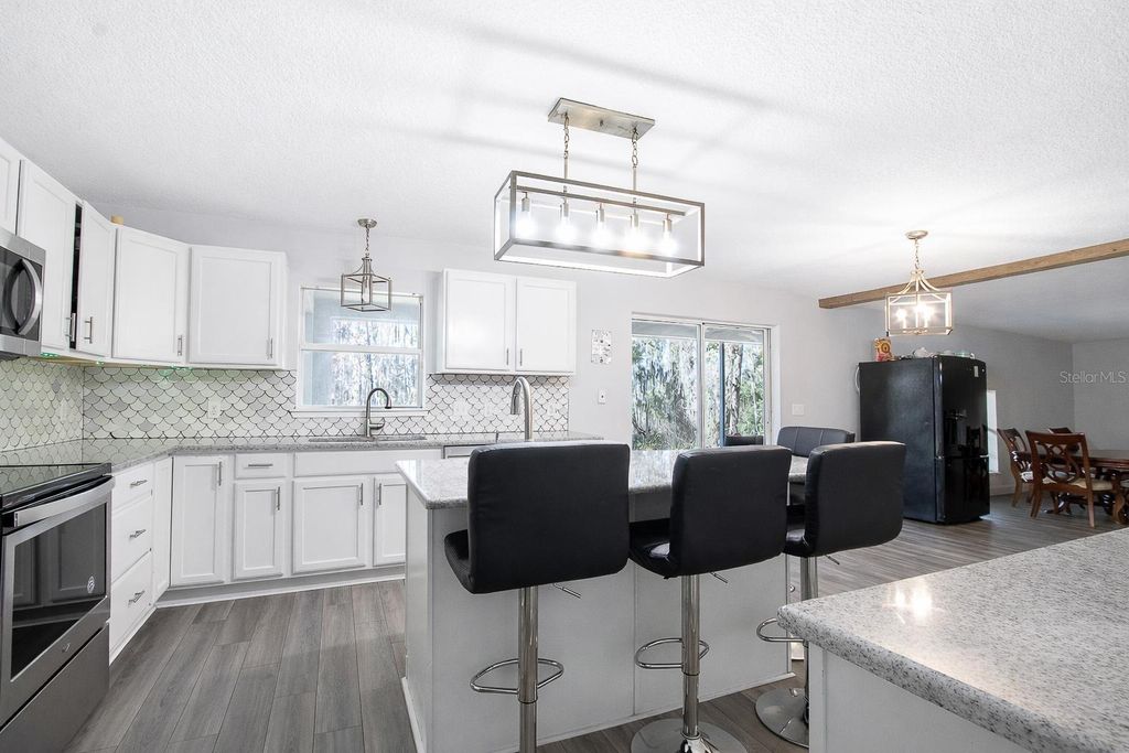 Photo of 1033 Tawny Eagle Drive, Groveland, FL 34736 (MLS # G5106504)