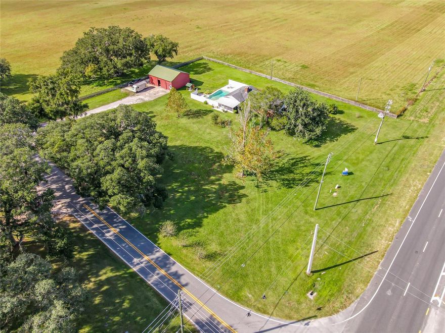 Back on the market!!  Location for a convenience store or quick food service restaurant?  With 270ft of Highway 301 frontage this property is located just a few miles from the ever growing Villages community, near the Florida Turnpike and I-75, 4 miles from state road 44, and 2 miles from CR 466.  Located on a busy intersection, with center turning lanes on highway 301.   With an Oxford address, this high and dry property just shy of 2 acres is within the city limits of Wildwood.  Current zoning is RM-10 however there are several properties in the same corridor that have recently been rezoned commercial and developed, as well as similar intersections having been approved for signalized lighting.  The current buildings were not used for assessment of value, the value in the property is the potential future use.  Call today for additional details!