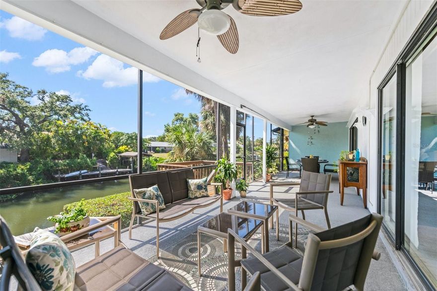 Canal front condo in the popular Schooner Bay gated community of just 36 units. It’s always about the view for an exceptional lifestyle. Enjoy the nearby Siesta Key experience from this 3 bedroom-2 bathroom waterfront residence.  You may also add a lift to the assigned dock at your doorstep with direct access to the ICW to enjoy a coastal lifestyle. There is a private 11x21 garage.  Low HOA fees, pet-friendly, newer roofs, sparkling pool, clubhouse, dual gates to conveniently have access to the nearby shops, restaurants, grocery-all within a quiet park-like setting. There is a private large front paver courtyard patio for morning coffee, BBQ and evening cocktails. The uncommonly large west patio is 10-by-36 feet, overlooking the sparkling canal with access off the Great Room and Owners suite. Main level living condo with spacious rooms and many recent updates in an open concept Kitchen with quartz and Owners Bath with walk in shower and outfitted closet. All rooms are generously sized, the 3rd bedroom has a Murphy Bed and built in desk. Large laundry closet and additional storage closet. Sold partially furnished. Minutes to culturally rich downtown Sarasota, Airport, Farmers Markets and an incredible way of living