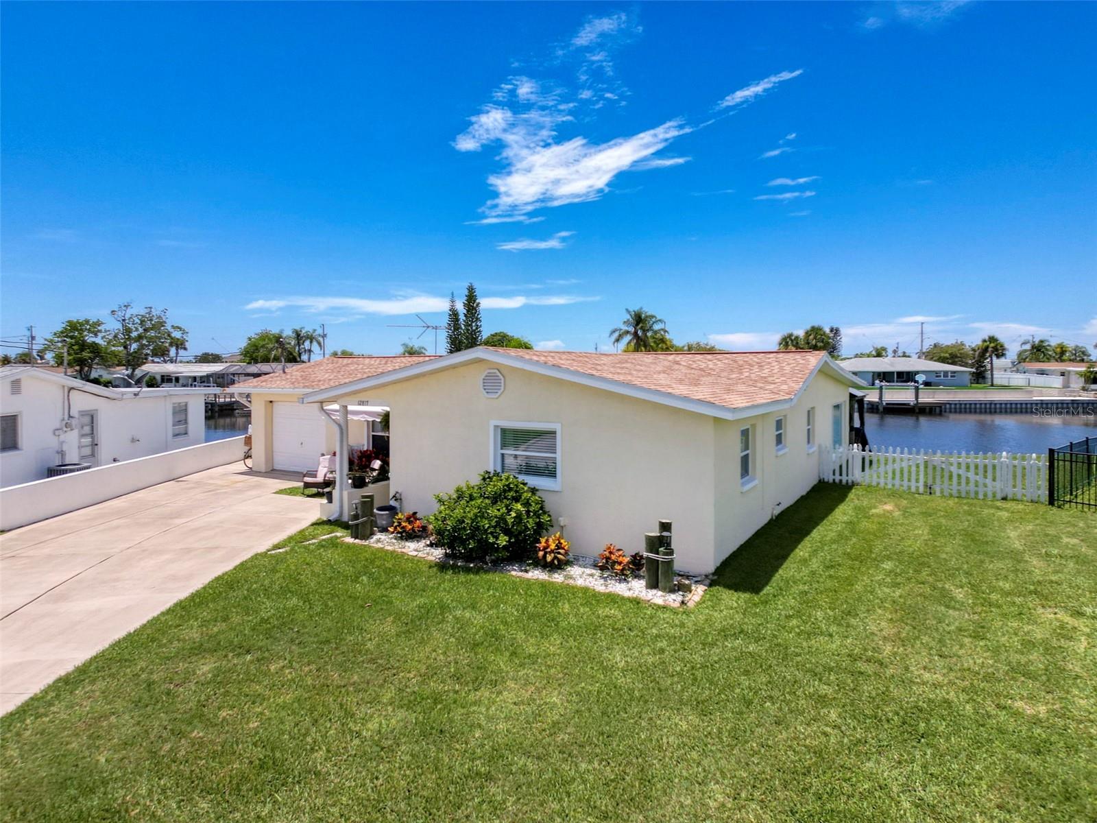 Welcome to Your Waterfront Dream in Leisure Beach!
Spectacular sunsets, dolphin visits, and Gulf breezes await! This beautifully maintained 2-bedroom, 2-bath Gulf access home is tucked away on a premium cul-de-sac lot with a rare 135 feet of water frontage and extra wide water canal access — just minutes to open Gulf waters!
Enjoy peace of mind with a 2015 concrete seawall, 2024 floating dock (12x20), and a 4-year-old roof (main & flat). Inside, the home shines with custom upgrades throughout: cabinetry, upgraded bathrooms, wide 16x16 porcelain tile, impact-rated PGT sliders and windows in the rear of the home, and LOE energy-efficient windows for the remainder.
Relax year-round on your large tiled air-conditioned family room with electric blinds and water views galore. On the back patio enjoy Bluetooth speakers, and a 16-ft electric awning — the perfect spot to take in west-facing sunsets that steal the show every evening.
The fenced side yard has room for your boat trailer, and there’s even space to add a pool. Fishing enthusiasts? Catch snook, redfish, trout, and more from your own backyard — or head offshore for grouper, mahi, and cobia in the legendary Middle Grounds. Local favorite anchoring spots include Durnkey and Anclote Island.
Leisure Beach is a true Florida waterfront community — no HOA, no CDD, but plenty of fun: monthly kayak club, golf cart rides to local hotspots, and friendly neighbors who love the salt life. Close to waterfront dining, beaches, marinas, and just 45 mins to Tampa International Airport.
Bring your boat, your kayak, and your favorite drink — paradise is calling!