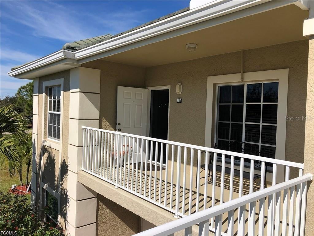 Photo of 2280 Somerset Ridge Drive #201, Lehigh Acres, FL 33973 (MLS # C7532086)