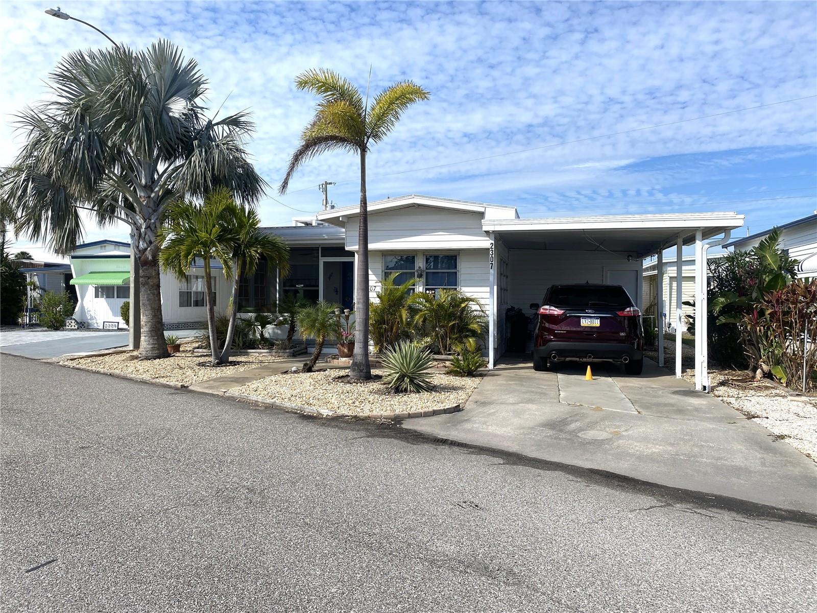 Furnished 3BR/2BA home in 55+ marina community of Trailer Estates available for 6-month+1 day to 1-year lease. Vintage charm meets modern updates including terrazzo floors, updated kitchen, and rare wood-burning fireplace. Features include screened lanai, covered carport, laundry/workshop area, and block-reinforced structure with recent roof, windows, and sewer line. Just half a block to the marina and bay. Lease includes cable, internet, trash pickup, and access to the community bayfront and TE beach pavilion recreation area, pool, hot tub, fitness center, and activities. 55+ community rules apply.