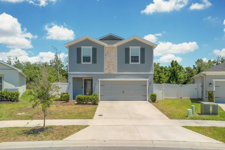 Welcome to this stunning 2022-built two-story home in St. Cloud, offering 4 bedrooms (with a versatile flex room that can serve as a 5th bedroom), 3.5 bathrooms, and 2,222 sq ft of thoughtfully designed living space. From the moment you step through the elegant glass-panel front door, you're greeted by luxury vinyl plank flooring, recessed lighting, and an open-concept layout that flows seamlessly from the foyer to the bright living and dining areas.
The chef-inspired kitchen features quartz countertops, gray shaker cabinets, stainless steel Samsung appliances, a large center island with breakfast bar seating, and a pendant chandelier — perfect for entertaining. The open family room boasts a ceiling fan, custom floating shelves, and a large sliding glass door leading to a covered patio overlooking a spacious fully fenced backyard — ideal for outdoor gatherings and Florida living at its best.
Upstairs, the expansive primary suite impresses with dual windows, plush carpet, recessed lighting, and a spa-like en-suite bath with a double vanity, quartz counters, glass-enclosed walk-in shower, and a private water closet. Secondary bedrooms are generously sized and share a Jack-and-Jill bathroom with double sinks. A large bonus/flex room with dual closets provides the perfect space for a home office, playroom, or 5th bedroom. The upstairs laundry room adds everyday convenience.
This home comes with a transferable leased solar panel system at only $125/month — a smart investment that can save you $100 to $200 monthly on your electric bill! With a 25-year agreement easily assumable by the new owner, you start saving from day one. In sunny Central Florida, this is a feature that truly pays for itself.
Additional highlights include a 2-car garage and a white vinyl privacy fence. Enjoy resort-style community amenities including a beautiful pool with covered cabana and a playground — all in a well-maintained neighborhood. No short-term rentals allowed. Don't miss this move-in ready gem in the heart of St. Cloud!