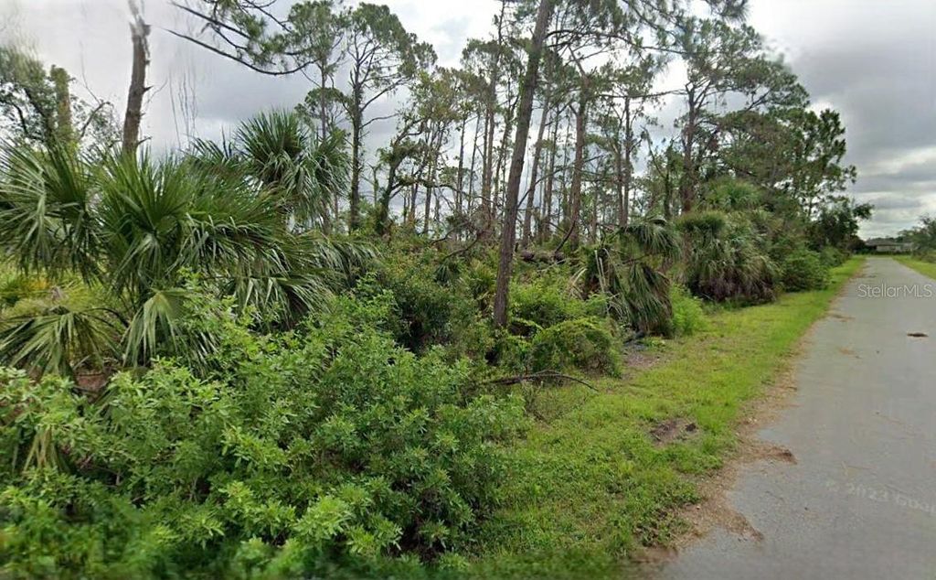 Photo of 15484 Whitehall Avenue, Port Charlotte, FL 33953 (MLS # O6328159)