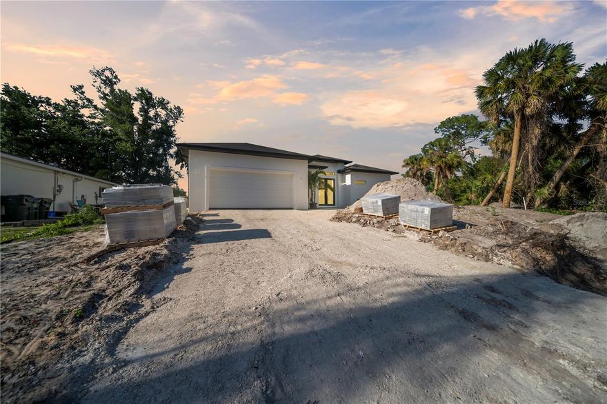 Pre-Construction. To be built. Modern open-concept home featuring 3 bedrooms and 2 bathrooms with a kitchen that includes a central island, a spacious great room ideal for entertaining, a covered lanai, and a two-car garage. The primary suite offers a walk-in closet and private bathroom, providing comfort and privacy. The property is not located in a flood zone, offering added peace of mind for homeowners. Photos are of a similar model.