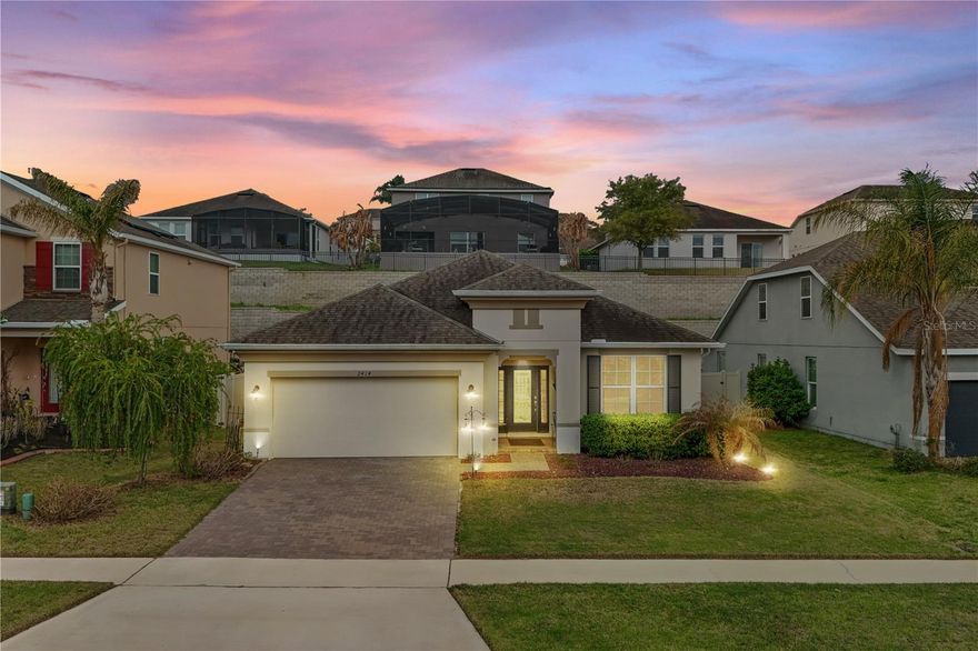 Beautiful Energy Star home built by Beazer Homes located in the gated community of Harvest Landing, offering water views of Lake Wilma in the front and no rear neighbors for exceptional privacy. This bright, open, and airy 4-bedroom, 3-bathroom pool home combines quality construction with numerous upgrades and thoughtful design.

The home features a split floor plan with 9-foot ceilings, 20-inch porcelain tile in the main living areas, and Pergo waterproof laminate flooring in all four bedrooms. Elegant crown molding throughout and upgraded light fixtures enhance the interior, while Hunter ceiling fans provide comfort in every room.

As you enter through the glass front door with sidelights, you’ll notice the open layout and convenient drop station in the entry. The chef’s kitchen includes granite countertops, white full-face cabinets with crown molding, a double oven, huge pantry, and a new kitchen faucet with air switch for the garbage disposal. The kitchen and dining area flow seamlessly into the living room with a stone fireplace, creating a perfect space for entertaining, all overlooking the backyard pool.

The primary suite is privately located at the rear of the home with beautiful views of the pool. The primary bathroom features granite countertops, dual vanities, a large walk-in shower, soaking tub, private toilet room, and a spacious walk-in closet. Two additional bedrooms share a Jack-and-Jill bathroom, while another bedroom and full bath is an ideal space for guests or multigenerational living.

Step outside to a private backyard oasis featuring a sparkling pool with a huge paver pool deck and retaining wall, a firepit area, and a low-maintenance landscape with artificial grass, pavers, and decorative stone pathways. The backyard is fully enclosed with a 6-foot ivory vinyl fence with two gates, offering privacy and security. There are also two outdoor storage options (a shed and cabinet) tucked neatly behind the fence.

Additional upgrades include gutters, granite and quartz countertops with new faucets and upgraded mirrors in two bathrooms, and a 4x8 overhead ceiling rack in the garage for extra storage. The home also features a hybrid water heater, heat pump system, separate laundry room, two-car garage, and paver driveway.

Residents enjoy gated access, a shaded playground, and a walking path around Lake Wilma, along with plenty of street parking along the lakefront. The community is conveniently located just minutes from Epic Theatres and Clermont Crossing, a 586,000-square-foot shopping and dining destination with approximately 46 stores and restaurants.

Situated in the scenic hills of Clermont, often called the “Gem of the Hills,” this area is known for some of the highest elevations in the Florida peninsula and beautiful rolling landscapes. The home is also conveniently located near Highways 27 and 50, providing an easy drive to Orlando International Airport, downtown Orlando, and world-famous attractions.

This exceptional home offers upgraded features, a private outdoor retreat, water views, and a prime location in one of Clermont’s most desirable gated communities.