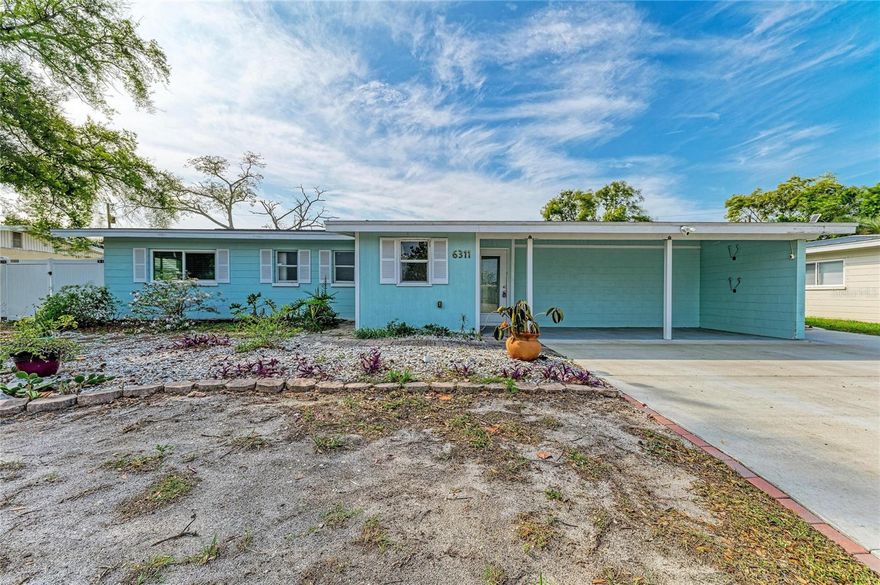 One or more photo(s) has been virtually staged. Opportunity awaits! This 3-bedroom, 3-bath home offers approximately 1,781 sq. ft. on a spacious .25-acre fenced lot, located just 5 miles from the beautiful white-sand beaches. Originally a 2-bedroom, 2-bath home, it was thoughtfully expanded in 2017 to include a primary suite with private en-suite bath, adding valuable living space and functionality. Built in 1959 and full of character, this home has great bones and incredible potential to update and make it your own. Enjoy Florida living with a newer saltwater pool and spa (2022), screened paver patio, and a Pentair IntelliCenter system (2023) for convenient pool management. The home also features an owned $48,000 solar system (2023), keeping utility costs low with electric bills averaging approximately $26–$41mo. Other major improvements include roof (2017), A/C (2021), and hurricane impact windows and sliders. Step outside to a private fenced backyard filled with mature fruit trees including avocado, mango, star fruit, lemon, and orange just to name a few. The extended paver patio is perfect for entertaining, with a concrete slab in place ready for a shed. Offering oversized and extended parking, including space for your boat or water toys. While the interior offers an opportunity for modernization, this property provides a solid foundation for renovation, investment, or potential short-term rental opportunity with NO HOA or rental restrictions. In a desirable location in NW Bradenton, and so close to the beaches, dining, and shopping right outside your door. This is your chance to unlock its full potential and to create your own Florida Paradise so hurry before it's too late.