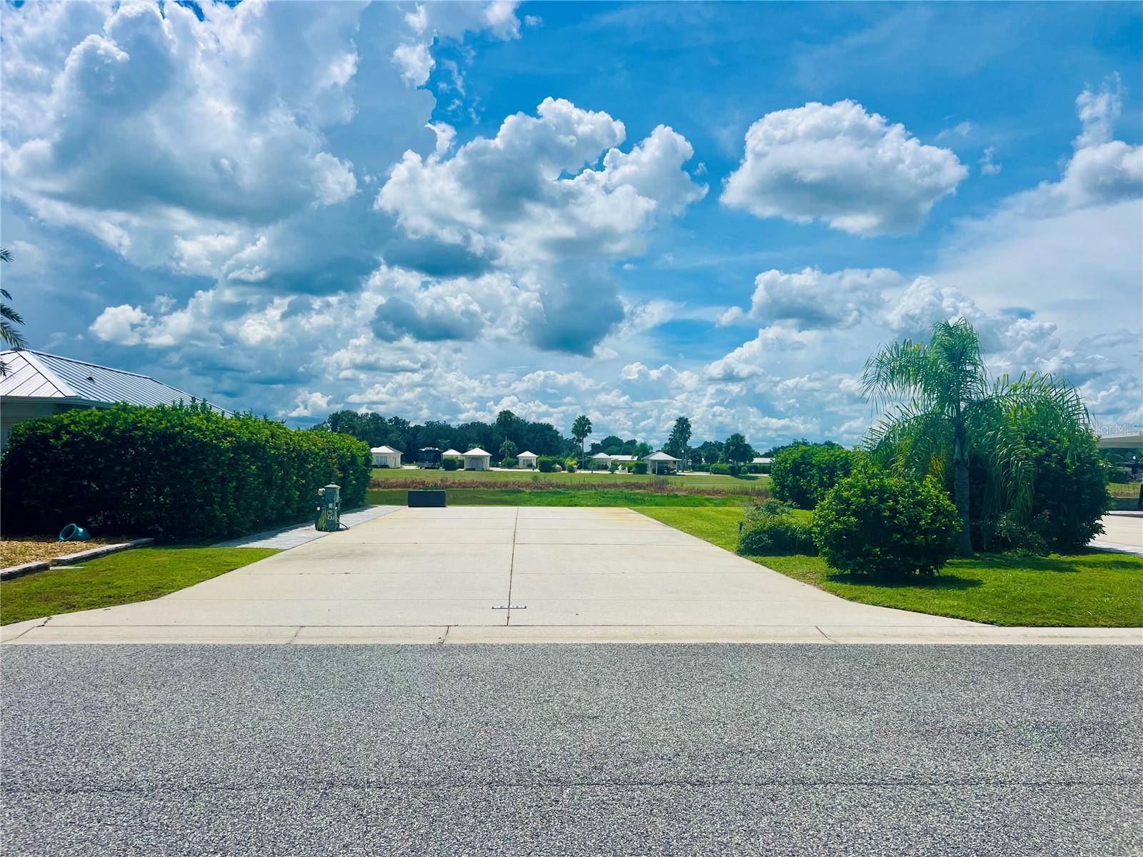 Welcome to Lot 297 at Florida Grande Motor Coach Resort, a 5,076 sq ft west-facing pull-in
property offering some of the most breathtaking sunset views in the resort. This lot backs up to
the serene wetlands, providing a front-row seat to Florida’s natural beauty with frequent
sightings of birds, ducks, and other wildlife. The pavers along the pedestal side of the pad add
both functionality and curb appeal, and there's room to add a 384 sq ft Grande Suite—customize
it to your needs and make it your own. Whether you're looking for a peaceful retreat or a lively
community, Florida Grande delivers. Known as Florida’s friendliest motorhome community, the
resort offers a welcoming atmosphere and a full calendar of activities during the winter season.
Perfectly located as a home base for exploring Central Florida, this property also offers rental
potential when you’re not using it. Don't miss this opportunity to own in one of Florida’s most
desirable motorhome resorts.