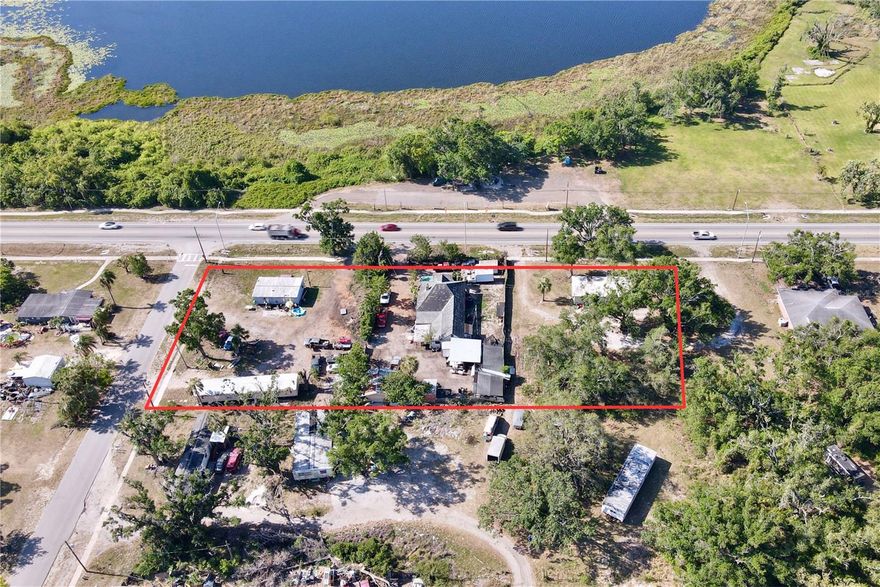 The opportunity is to purchase 1.4 acres along State Road 674 in Wimauma. There are three houses on the property: two 2 bed/2 bath manufactured homes (864 square feet and 1,071 square feet), and one 3 bed/2 bath single-family home (1,996 square feet).

Water runs to the site along State Road 674 and sewer lines run to 9th Street (494 feet from the western property line).

The property is zoned RSC-6 (allows for six units per acre) with a future land use of RES-6. In addition to residential, RES-6 allows for neighborhood commercial, office, and mixed use. The parcels are located within the Government District of the Wimauma Village Plan. The Government District is a special district within the Downtown Center that is consistent with the Downtown Center but is focused on institutional uses. The Downtown Center encourages higher density residential and some retail/office uses. Government District promotes, but does not require, government and institutional uses. 

The site is located at 5534 State Road 674 in Wimauma (Hillsborough County). It has significant frontage along State Road 674 (370 feet) as well as along Maggie Street (168 feet). It is 0.8 miles west of County Road 579, 1.6 miles east of US Highway 301 and 3 miles east of I-75, providing easy access to major roads.

It is within a short commute to Sun City Center (7 minutes), Parrish (20 minutes), FishHawk (25 minutes), Tampa (40 minutes), and Tampa International Airport (45 minutes).