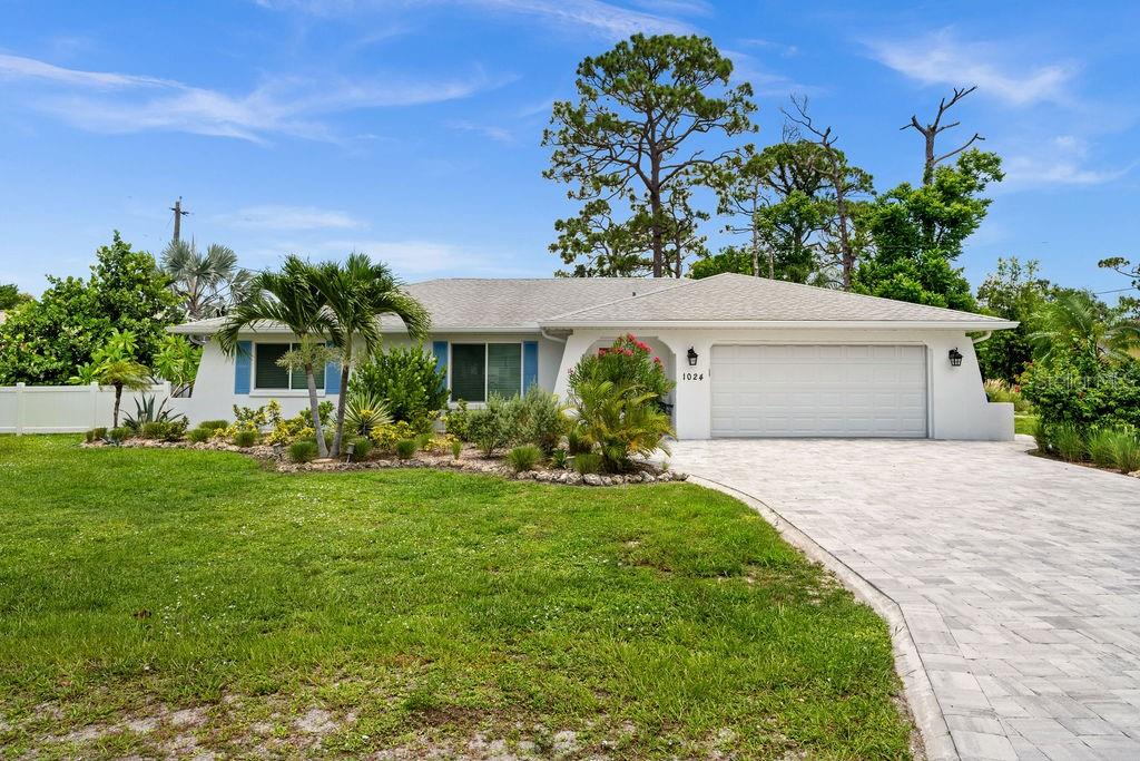 Location, location, location! Don't miss this tastefully remodeled South Venice house with an OVERSIZED 120x100 LOT, just a phone call away! WOW… Just a short distance to Caspersen Beach, Shamrock Park, and Sharky's On The Pier Beach! NO HOA/CDD FEES, NO DEED RESTRICTIONS. This beautiful home with a 2-car garage has tons of upgrades and meticulous attention to all details, design, and finishes. The impressive OPEN FLOOR PLAN is just perfect for you, featuring large windows that let in plenty of natural light, an elegant living room, and high-quality ceramic tiles throughout. The good-sized dining area has upgraded light fixtures and fresh paint, new trim work, doors, and more. The spa-like Master Suite includes DOUBLE SINKS. Some updates include: Window/Door Replacement (2022), Roof Shingle Tear-Off/Replace (2013), Brand New Hot Tub/Spa (2022), Brand New Garage Door (2021), Lovely Mature Landscaping, and a Very Durable Interlock Driveway that will last decades (2022). The remodeled kitchen boasts custom-made cabinets with granite countertops and a matching backsplash, along with a stainless-steel high-end brand-new SAMSUNG appliance package and ample counter space, making this place perfect for year-round entertaining for your family and friends. Both bathrooms have been updated, and much more! WASHER & DRYER included. Minutes away from South Venice Beach Ferry, historic downtown, Venice Island, Gulf of Mexico beaches, restaurants, and The Venetian Waterway Trail, which offers nature trails, biking paths, tennis courts, and much more. Enjoy paradise in your own backyard with this gorgeous screened COVERED LANAI, a $10,000 hot tub, and a FULLY FENCED backyard perfect for any occasion, with extra space for all your toys, RV, trailered boat, or jet skis. BONUS: an additional detached garage-shed measuring 14.5 x 12.5 ft.