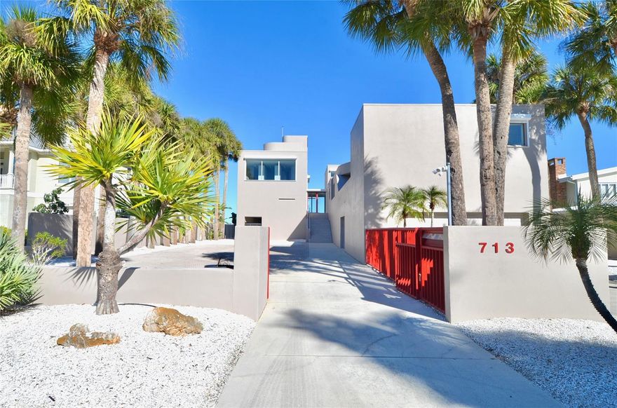 One or more photo(s) has been virtually staged. Bayfront Venice • Designed by architect Carl Abbott • 0.5 mi to Venice Beach • 1.0 mi to Historic Downtown Venice • Roof deck with planetary observation platform

Set on the bayfront along Roberts Bay, this architecturally significant residence designed by Carl Abbott blends sculptural form with experiential living. Located along El Dorado Drive in Venice, the home spans approximately 4,990 square feet with five bedrooms and four baths, organized into distinct public and private living zones for both entertaining and retreat. Expansive windows, decks, and open courts frame panoramic water views while maintaining privacy from neighboring properties. The private wing includes a multi-level primary suite featuring a glass floor overlooking the pool and a skylight visible from the ground level, creating a direct visual connection to the sky. Curved interior walls guide movement throughout the home, contrasting with the clean-lined exterior massing. A rooftop observation area offers elevated views of Roberts Bay and the Gulf, the night sky, and beautiful sunrises. Exterior security shutters function as architectural elements while providing heat control and storm protection. Two outdoor environments enhance livability: a west-facing private entrance courtyard and an open bay-side court integrated with the landscape. A deep scuba training pool adds a rare recreational feature, while the attached garage provides secure parking. Conveniently positioned approximately 0.5 miles from Venice Beach and 1.0 mile from Historic Downtown Venice, the property is also close to dining, shopping, cultural venues, parks, golf courses, and the Legacy Trail. This bayfront residence offers architectural distinction, privacy, and proximity to the best of coastal Venice living.