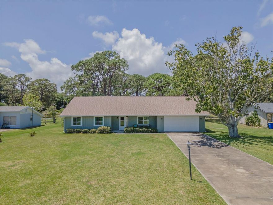 Rare opportunity to own a beautiful home that sits on a .78 acre lot directly across from the Indian River on scenic Riverside Drive, just minutes from the beaches of New Smyrna. This is a lovely and well maintained 3-bedroom 2 bathroom home with almost 2000 sq ft of living space. As you walk through the front door, you are greeted with light sandy colored bamboo flooring and an unobstructed view to the sprawling backyard. The bedrooms and bathrooms are situated privately on one side of the house and there is an additional room that can be used as an office, playroom or easily converted to a 4th bedroom. The kitchen has beautiful wood cabinets with plenty of storage and a large walk-in pantry. The living room offers vaulted ceilings with hurricane impact skylights for natural lighting and a cozy mantel and wood burning fireplace. Off the living room is a newly added, 22x18 Great Room for endless entertainment options. This space has its own HVAC split and hurricane impact windows for a bright and airy feel. There are 2 exterior doors that offer access to the patio and backyard. Bring your imagination with the potential to add a large pool and turn the outdoor space into a tropical oasis. There is also a large 10x14 shed for additional storage. 
This is your chance to own a home situated directly across from the Intracoastal. Just a 1 minute walk to Veterans Memorial Park, a 4 min drive to the boat ramp at Menard-May park which accesses the Indian River and some of Florida’s best fishing and a short drive to New Smyrna Beach. Plenty of room for your boat, RV or workshop. No HOA. New roof in 2018. Hurricane windows and skylights. Solar hot water heater. Updated pest inspection & treatment (Expires May 2024). High and dry, No flooding or water damage. Separate well with dedicated pump for irrigation or other water usage to cut down on city water. 
You’re sure to love this home and the salty cool breeze coming off the Indian River. Don’t wait, this home won’t last. ;Water: City