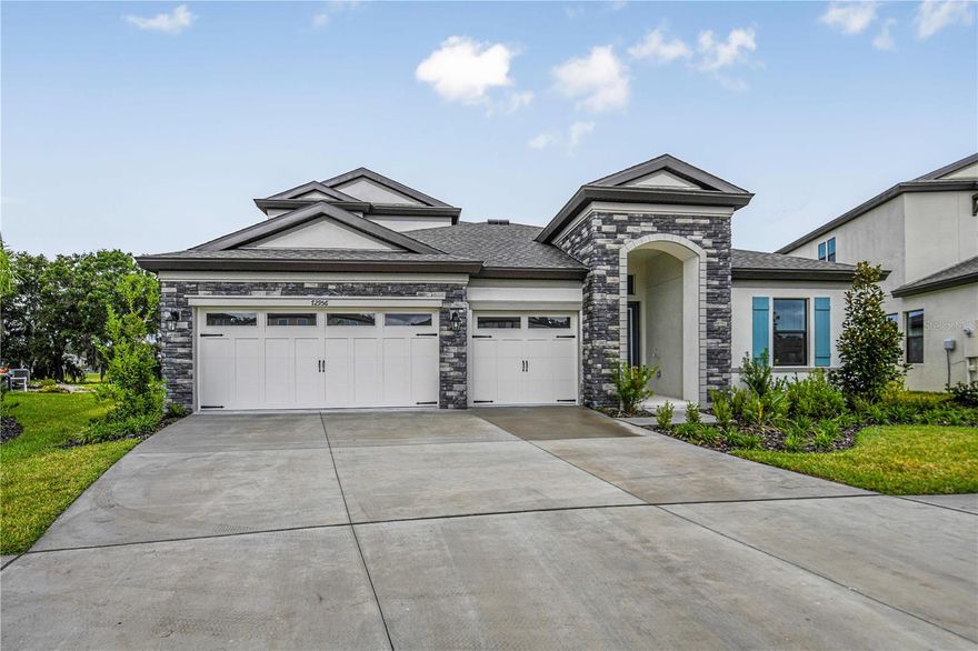 For a limited time, Homes by WestBay is offering $46,000 towards buyer’s closing costs, pre-paids, rate buydowns, or off the price of this home. Promotion amount is specific to this home only.
This Bayshore II Quick Move-In home is READY NOW! This home features our “Tranquil Transitional" Design Collection interior: Kinsdale Maple Slate cabinets, Snow Flurry Quartz counter-tops, Floorte Prominence Plus Executive Oak LVP flooring, and more. The Bayshore II offers easy living with an open floorplan, while still offering privacy for the owner's retreat and secondary bedrooms. Follow the wide foyer to the heart of the home—a combined grand room, deluxe kitchen and casual dining that blends to outdoor living with access to the large covered lanai. From the grand room, enter the owner’s retreat complete with dual walk-in closets and well-appointed master bath. Upstairs, a bonus room, bedroom and additional bathroom provide extra living space. 

Hawkstone is a master-planned community located in Lithia, FL. Residents enjoy the best of both worlds with resort-style amenities while staying close to top-rated Lithia schools, nature preserves, family-friendly activities, US-301, and I-75. Enjoy the pet-friendly hiking trails at the 969-acre Triple Creek Nature Preserve, less than 2 miles south or try your hand at bicycle motocross at Triple Creek BMX, 1 mile south of Hawkstone.

Images shown are for illustrative purposes only and may differ from actual home. Completion date subject to change. 
Exterior claimer statement: Exterior image shown for illustrative purposes only and may differ from actual home.
Completion date subject to change.