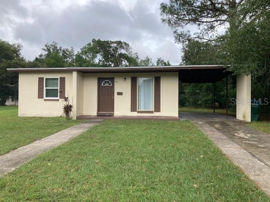 2 bedroom, 1 bath home in Deltona. New flooring throughout, New cabinets and countertop in kitchen. Separate laundry room on back of house and covered parking, and on a large lot. Close to I-4 and convenient to shopping. No pets, please.