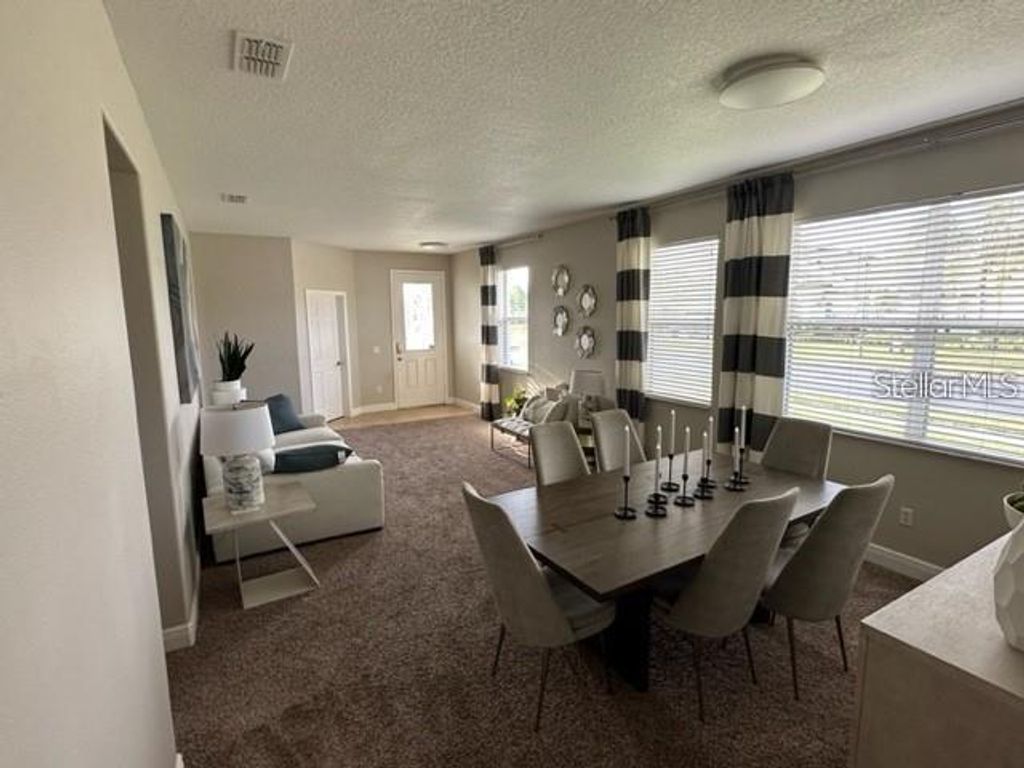 Photo of 483 Setting Sun Drive, Winter Garden, FL 34787 (MLS # O6379134)