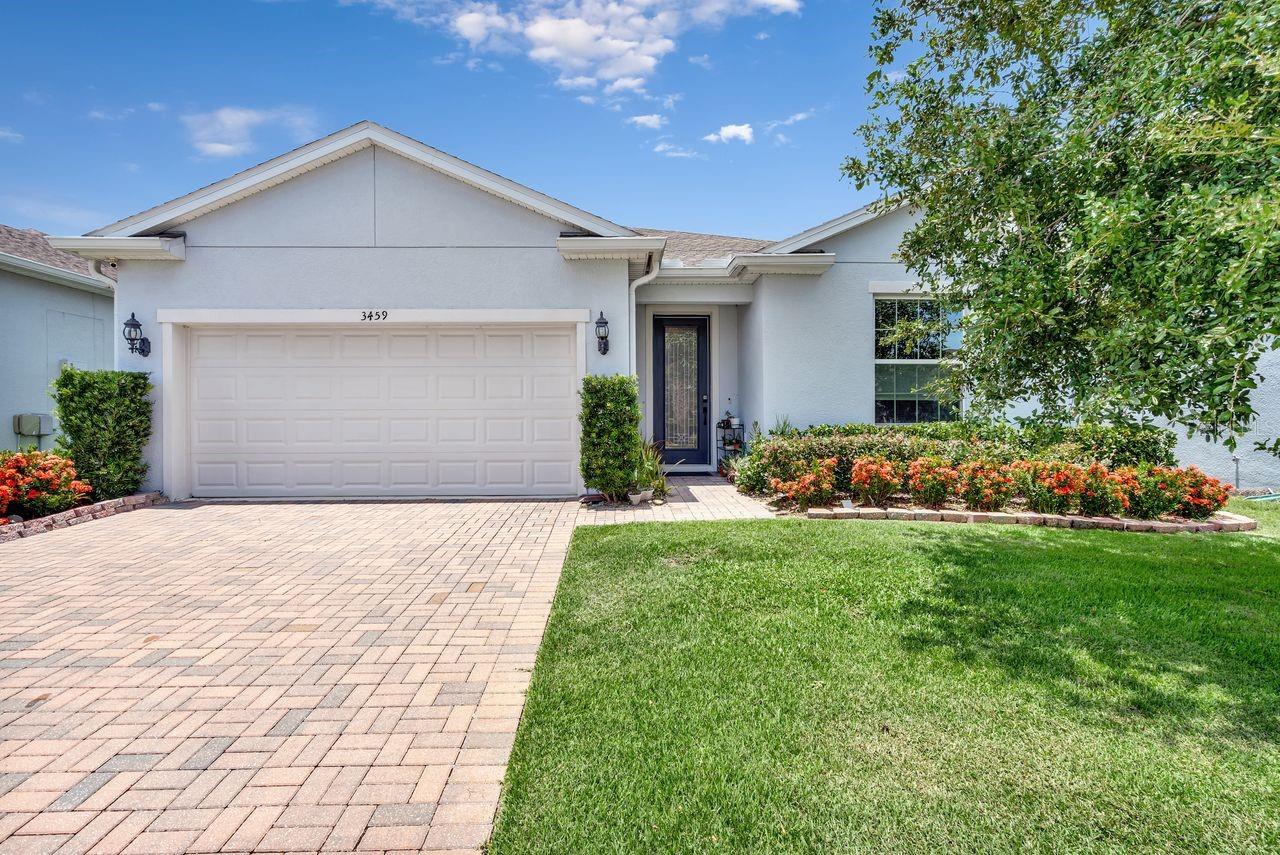 SOPHISTICATED AND SPACIOUS SINGLE-STORY HOME! Three large bedrooms plus a flex room! This open floorplan Lakeview Preserve home is loaded with modern, smart-home touches and upgraded features, such as WOOD-LOOK TILE flooring throughout the whole home. At the front of the home, there is a large FLEX ROOM that is perfect for an office, study, or game room! The large kitchen is a chef’s dream with steely gray cabinetry, slick white countertops with black hexagonal backsplash, touchless sink faucet, large electric range with stainless steel range hood that vents out, and HUGE ISLAND for prepping and entertaining. This is all open to the spacious living and dining space, which connects seamlessly to the outside through sliding glass doors, allowing for the perfect setup for entertaining inside and out. The large primary suite is located off the living space at the rear of the home, and features a WALK-IN CLOSET with upgraded built-in shelves and drawers plus dream primary bathroom with dual sink vanity and HUGE upgraded glass and tile WALK-IN SHOWER! The two guest bedrooms are in their own wing of the house, allowing for maximum privacy, and share their own guest bathroom with large vanity (and possible second sink!) and upgraded tile shower and tub. Also inside is a spacious laundry room with large wooden folding top and extra storage shelves, as well as a convenient half bathroom. Stepping outside, you are greeted with a large and private COVERED PATIO, perfect for enjoying the wonderful Florida weather! The gated Lakeview Preserve community features a RESORT-STYLE COMMUNITY POOL, children’s splash pad, outdoor cabana, stylish clubhouse with fitness center, and playground - PLUS a waterfront community dock and kayak launch on Johns Lake! The location is prime, with easy access to SR-429, US-27 and FL Turnpike making commuting a breeze. Also enjoy a quick drive to local shopping, dining, and entertainment destinations like Downtown Winter Garden, Winter Garden Village shopping center, Downtown Clermont, Walt Disney World, Universal Orlando, and more! Do not miss out on your chance to make this home your Florida oasis, schedule your private showing today!
