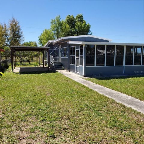 Photo of 17428 SE 37th Lane, Ocklawaha, FL 32179 (MLS # OM697792)