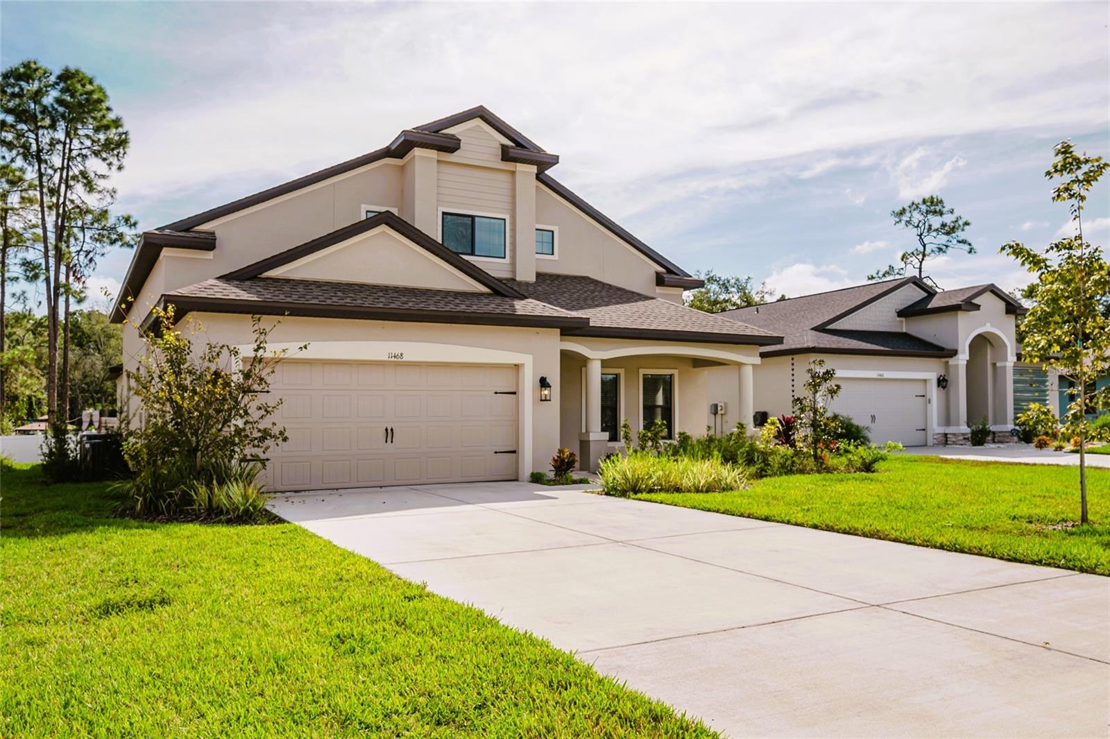 One or more photo(s) has been virtually staged. BRAND NEW, never been lived in, spacious two-story, 4-bedroom, 3.5 bath home in the gated community of Rose Haven with many upgrades. Features a first-floor master suite with access to the covered rear lanai. The master bath features wood plank tile, a separate shower with a soaking tub, and a quartz countertop that appears to have specs of diamonds embedded in it. There is a formal dining room, a dedicated office with French doors, and a gourmet kitchen with 42-inch wood cabinets, along with quartz countertops. Upstairs, you will find two additional bedrooms that share a full bath, as well as a third bedroom with its own ensuite bathroom. A partially fenced back yard will accommodate a pool if desired. Additional upgrades include two Trane a/c units dedicated separately for both the upstairs and downstairs, foam-insulated exterior walls, and pre-wired security. In addition to the 2-car garage, the oversized driveway accommodates 4-6 extra vehicles. Low HOA of $114 per month covers trash, basic cable, pool, and gated entrance. Conveniently located just 10 minutes to the Suncoast Parkway/Veterans Expressway, and 20 minutes to the beaches.