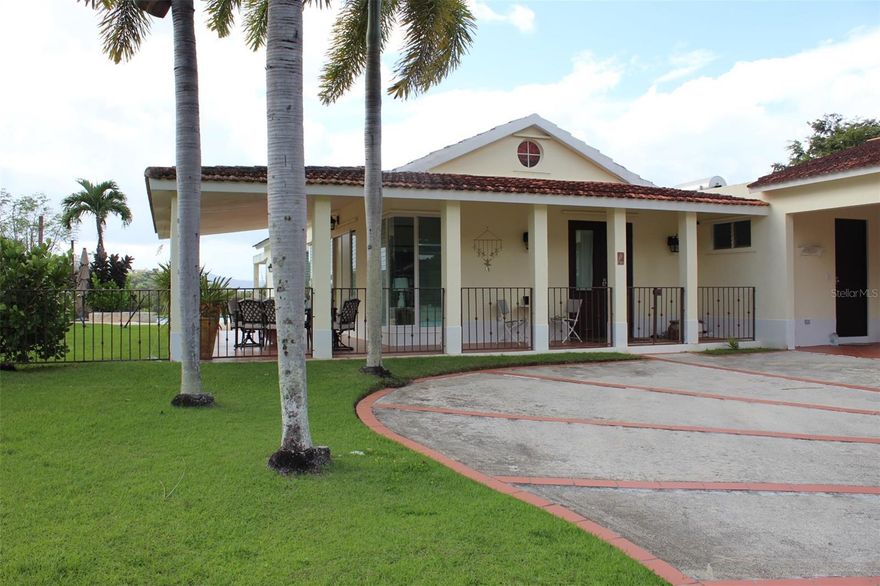 Beautiful single-level residence located in the exclusive gated community of Sabanera Del Río in Gurabo. This spacious home offers approximately 2,700 sq ft of interior living space with an open and functional layout designed for comfort and entertaining.

The property features 4 bedrooms and 3 bathrooms, along with a flexible home office space. The interior flows seamlessly into a covered terrace connected to the covered front porch, creating an ideal environment for relaxing or hosting gatherings.

Outdoor amenities include a private swimming pool and exterior bar area, perfect for enjoying Puerto Rico’s year-round outdoor lifestyle. The home also offers covered parking, a backup generator, cistern, and transfer switch, providing added convenience and reliability.

Located within a gated community with mountain views, the property offers privacy while still maintaining convenient access to the greater San Juan metropolitan area.

The home is in excellent condition and move-in ready.

VA financing eligible.