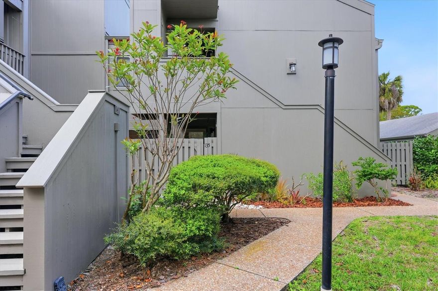 Ideally located in the heart of Osprey, this private corner, first floor condo offers effortless Florida living just minutes from pristine Gulf beaches and less than half a mile from the Intracoastal Waterway. The sought after community at the entrance to Casey Key was designed to live in harmony with nature by Frank Folsum Smith of the Sarasota School of Architecture.  This unit features a garden view with four patios that includes a rear lanai enclosed with sliding vinyl windows.  A unique inner atrium with aquarium style glass windows adds architectural interest and abundant natural light while maintaining privacy.  The unit features easy to maintain custom tile floors on the diagonal throughout with wood floor inspired ceramic tiles in the bedrooms.  Since 2023, unit updates include all new kitchen appliances, new faucets, new PEX water lines, a new water heater as well as new paint inside and out.  The unit also includes a deeded carport parking space and two storage closets.  Onsite resort style amenities include two heated pools (one overlooking a lagoon), two cedar saunas, a fitness room, Florida style clubhouse, walking trails, BBQ gas grill, outdoor gas fireplace, kayak storage, pickleball and tennis courts.  Within a mile is the Pine View School (the only standalone public gifted school in the state), Oscar Scherer State Park, 2 kayak launches, a public boat ramp, Casey Key Fish House, Walmart and a Post Office.  Easily walk to Publix, Ace Hardware, CVS, shops and restaurants or bike to the Legacy Trail and Nokomis Beach.  Exceptional privacy, easy access, and a premier location make this residence an outstanding opportunity. Priced to sell!