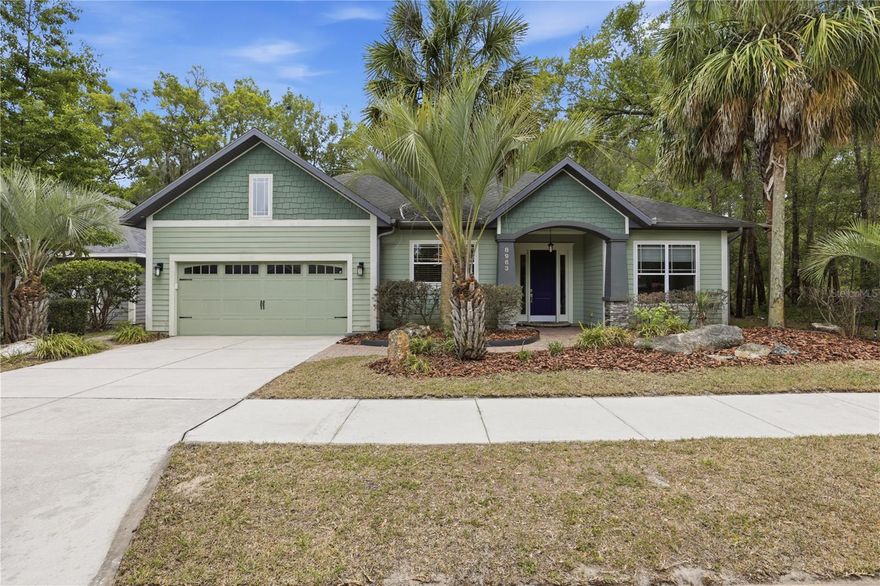 Tucked along the southern edge of Willow Oak Plantation, this custom-built Tom Hunt home offers a rare combination of privacy, quality craftsmanship, and natural surroundings. Built in 2009 and positioned beside a designated conservation area, the property enjoys a peaceful setting with no rear or side neighbors.
Thoughtfully designed for both everyday living and entertaining, the home features extensive crown molding, tray ceilings, recessed lighting, wide-plank wood flooring, and new interior paint throughout. The spacious great room centers around a floor-to-ceiling stone accented gas fireplace and opens beautifully to the screened pool and spa through triple sliding glass doors that fully retract into the wall, creating a seamless connection between indoor and outdoor living spaces. Large windows and expansive sliding glass doors allow natural light to fill the living spaces while showcasing the surrounding conservation area views.
The gourmet kitchen offers custom wood cabinetry, granite countertops, recessed electrical outlets, stainless appliances, spacious pantry, breakfast bar with tiled accent wall, and gas range.
The private owner’s suite features a high tray ceiling, crown molding, direct access to the pool lanai, and a luxurious ensuite bath with dual vanity areas, two spacious walk-in closets, claw foot soaking tub, separate walk-in shower, and private water closet.
Additional features include a central vacuum system, tankless water heater, inside laundry room with washer, dryer, utility sink, and storage closet, along with flexible use of Bedroom 4 through glass pocket doors that create an ideal study, office, or guest space.
Outdoor living areas include paver walkways and a spacious screen-enclosed pool and spa with covered lanai overlooking the peaceful wooded conservation setting.
The oversized garage layout includes a separate 13x13 workspace area adjacent to the two-car garage complete with utility sink, built-in cabinetry, work surfaces, refrigerator hookup, and wall-mounted storage organizers ideal for hobbies, projects, or additional storage needs.
Surrounded by mature landscaping and conservation views, this property offers a private retreat within one of SW Gainesville’s desirable neighborhoods.