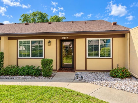 Photo of 11311 Dollar Lake Drive #6, Port Richey, FL 34668 (MLS # W7890386)