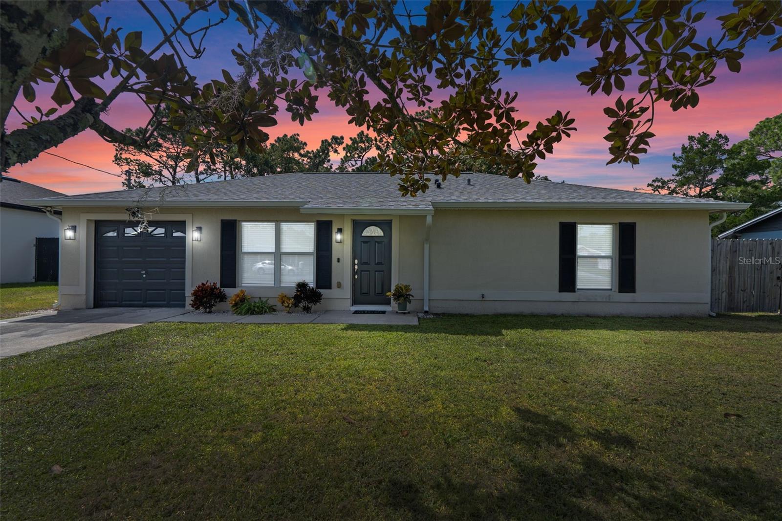 This bright and open Deland home is ready for you to move right in! Located on a street full of well kept homes, this home is clean, updated and ready for you to move right in. Lots to love about this home including fresh interior paint, newer stainless Samsung and LG kitchen appliances, Whirlpool washer and dryer package, luxury vinyl plank flooring, 2024 NEW ROOF and gutters, 2023 HVAC system, 2025 water heater, newer fence, a gorgeous magnolia tree in the expansive backyard and the double gate access to the backyard, perfect for RV or watercraft parking! 30 minutes to the beach! Check out downtown Deland boutique shops and restaurants. 45 minutes to Orlando! This centrally located home offers the serenity of being far enough from city life with the convenience of being close to major stores, places to eat and exciting places to set off on a fun day trip or just getting to work! Get ready to fall in love with this home!
