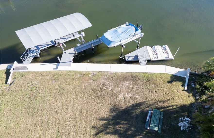 Build your waterfront dream home on this exceptional Gulf-access lot—just a 3-minute idle to open Gulf waters, with no bridges and true deep water. This property is fully prepared for construction and enjoyment from day one.
Your private marina is already complete, featuring:
Two 13,000-lb covered boat lifts Large floating dock + small floating dock,

Brand-new 84' concrete seawall Utilities are ready to go with water, sewer, and electric already installed, and the geological report is done—bring your plans and start building immediately.

While your dream home is under construction, enjoy full use of the property: bring your yacht, flats boat, and jet skis and take advantage of the incredible access and amenities.

Located in the desirable Gulf-front community of Hudson, a friendly, golf-cart-approved area known for beautiful sunsets and relaxed coastal living.

With all major groundwork already completed, this rare opportunity can save you hundreds of thousands in prep and build costs.

Opportunities like this don’t last—submit your offer today!