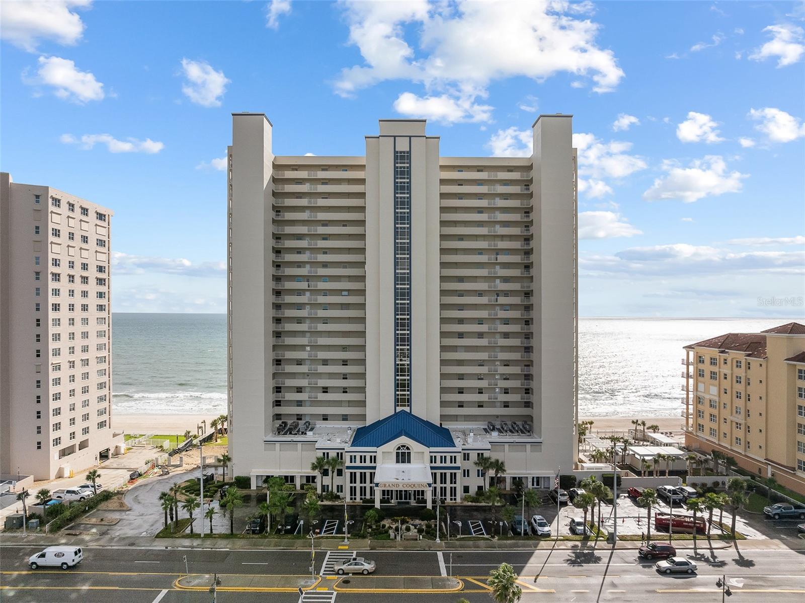 Your carefree beach lifestyle awaits at this DIRECT OCEANFRONT unit with breathtaking ocean views from the 6th floor! This spacious 2 bedroom 2 bath unit features a fantastic open concept layout with large living and dining areas offering incredible ocean views and access to a large private oceanfront balcony. The unit includes a well equipped kitchen offering ample cabinet and counter space. The oceanfront master suite boasts sliding door access to the balcony, a private ensuite bathroom with walk in shower, and soaking tub. There's also a guest bedroom, a full guest bath, and in-unit laundry. Loved by year-round residents, snowbirds, and vacation rental investors alike, the Grand Coquina condo community boasts resort style amenities like sparkling indoor & outdoor pools, hot tub, fitness centers, private garage parking for owners, and a Club room. Pet and investor friendly HOA policies here allow for up to 2 pets under 30 lbs and 2 week minimum rentals. It's time to make your beach dreams a reality! Schedule your showing today.