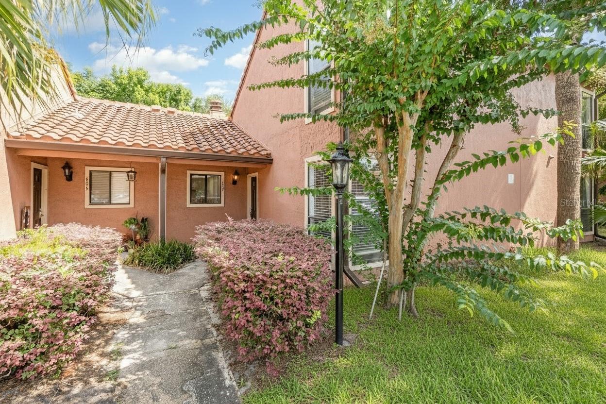This beauty just got a Great NEW PRICE!!! Check out this stylish (and now even MORE Affordable) townhouse in beautiful Winter Park! Featuring both an upstairs AND a downstairs bedroom plus 2 FULL baths, a covered patio, and a fenced yard for added privacy and outdoor enjoyment. Conveniently located in Winter Park and just minutes to Full Sail University!
Inside, you’ll find an open floor plan with vaulted ceilings and a cozy wood-burning fireplace. Along with an updated kitchen, updated bathrooms, and all solid-surface flooring (ceramic tile and luxury vinyl flooring) so no carpet anywhere! A versatile floor-plan with a large living/great room, separate dining room, kitchen with breakfast bar, spacious bedrooms and TONS of storage! Outside features a covered patio, with exterior storage, and a semi-private yard with fence. 
Additional highlights include a NEW barrel tile roof (replaced in 2021), fabulous community amenities which are literally just steps away including tennis/pickleball courts, community pool and pet stations throughout... ALL included and maintained by the HOA!
This is the perfect blend of comfort, convenience, and Winter Park living - with easy access to all the best of Central Florida: 25 minutes to downtown, 30 minutes to the Airport, and less than 45 minutes to Disney/Universal/Epic Universe, etc... and local beaches!