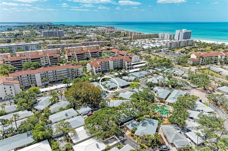 Tucked just minutes from the world-renowned Siesta Key Beach, this turnkey furnished home offers an exceptional opportunity to enjoy the best of coastal living within the charming Polynesian Gardens community. Known for its powdery white quartz sand and crystal-clear Gulf waters, Siesta Key Beach is consistently ranked among the top beaches in the country, and here, it is just moments from your door. This residence is designed for effortless indoor-outdoor living, featuring a spacious screened lanai and an expansive private courtyard surrounded by lush tropical landscaping. The courtyard is a true highlight, offering multiple seating areas, paved space, and a peaceful, secluded setting that feels like your own personal retreat, perfect for entertaining, relaxing, or simply enjoying the Florida lifestyle year-round. Recent upgrades include a new roof, new AC, new appliances and hurricane impact-rated windows and doors, providing comfort, efficiency, and peace of mind. Inside, the layout flows comfortably with an open feel that connects naturally to the outdoor spaces, creating a light and inviting atmosphere. The flexible floor plan makes this property ideal as a full-time residence, seasonal getaway, or investment opportunity. Polynesian Gardens is a sought-after, low-density waterfront community offering a unique blend of privacy and access. Residents enjoy direct access to the Intracoastal Waterway with community boat dock, bring your fishing rod & kayak and explore our beautiful water. The community also features a resort-style pool surrounded by mature tropical landscaping, creating a relaxed, vacation-like environment. In addition to its waterfront amenities, the location is incredibly convenient with close proximity to shopping, dining, and daily essentials, as well as easy access on and off the island. Whether your day includes boating along the Intracoastal, spending time at the beach, or enjoying quiet evenings in your private outdoor space, this property delivers a lifestyle that is both relaxed and connected. Opportunities like this, combining location, outdoor living, and access to both beach and boating, are increasingly hard to find on Siesta Key, and even harder to forget once you’ve experienced it in person.