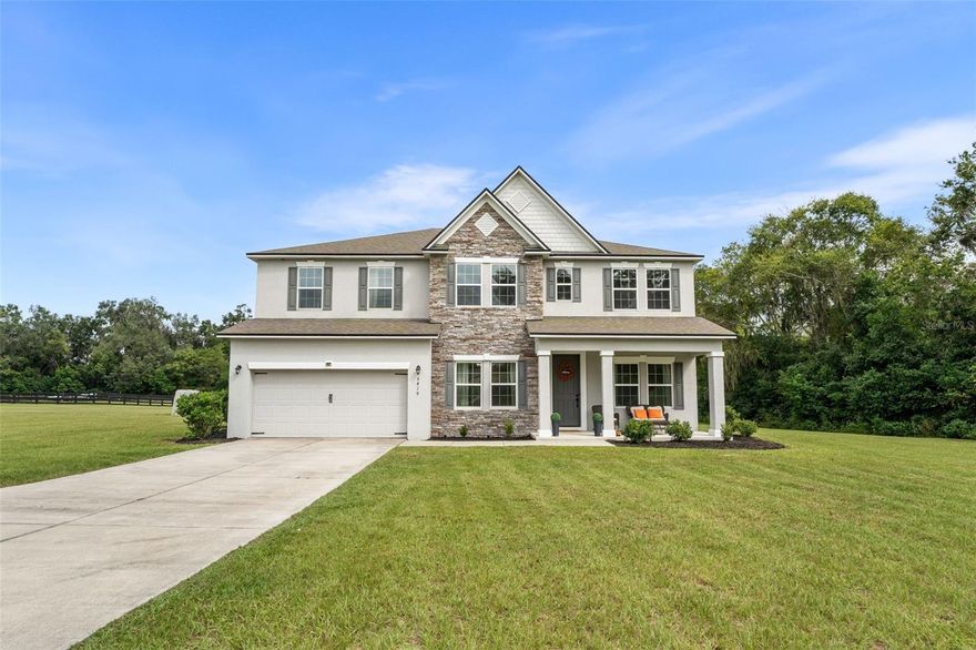 Welcome to this beautifully designed home, built in 2018, nestled on 2.82 private acres in a gated community in the city of Newberry. From the moment you step inside, you’ll appreciate the thoughtful layout and space designed for both everyday living and entertaining. The foyer opens to a charming sitting area with large windows that overlook the front porch and the scenic property beyond—perfect for morning coffee or evening relaxation. Just off the entry, the formal dining room offers a seamless flow into the kitchen via a hallway complete with a pantry closet for extra storage. At the heart of the home is the open-concept kitchen featuring an island with bar seating, overlooking the spacious main living area—ideal for gatherings and easy conversation. A convenient half bath on the main floor is perfect for guests. Also on the first floor is a private bedroom with an attached full bathroom, offering flexible use as a guest suite or second primary bedroom. Upstairs, a central living area provides a great flex space—perfect for a media room, play area, or lounge. The upstairs primary suite is a true retreat, boasting a luxurious en-suite bathroom with a walk-in shower, soaking tub, and large walk-in closet. Two additional bedrooms share a well-appointed Jack and Jill bathroom, while a fourth upstairs bedroom enjoys its own private full bath—ideal for guests or multi-generational living. With over 2.8 acres to call your own, there's plenty of room to enjoy the outdoors in peace and privacy, all while being just minutes from the amenities of downtown Newberry. This spacious home offers the perfect blend of function, comfort, and privacy—ideal for large households or those who love to host.