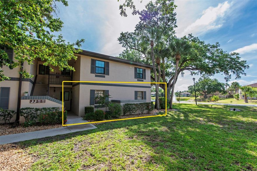 Discover the perfect blend of comfort and convenience at The Oaks IV condominium in the heart of Port Charlotte! This charming, partially furnished first-floor end unit offers three spacious bedrooms and two full bathrooms in an inviting open-concept layout. Step inside to find a retreat featuring luxury vinyl and tile flooring, a cozy living room with fireplace, and a bright kitchen with a large refrigerator, dishwasher, oven, cooktop, tray ceiling, and cheerful cabinetry. The primary suite boasts stylish tiled bathroom with tub/shower combination, vanity, and extra lighting, while the secondary bathroom offers a walk-in shower. A flexible third bedroom provides ideal space for guests, a home office, or additional living area.  Relax on the covered, screened lanai overlooking tranquil greenspace and mature trees, with no history of flooding for added peace of mind. The well-maintained, non-smoking community enhances your Florida lifestyle with a heated swimming pool, shuffleboard courts, clubhouse, picnic areas, scenic walking trails, and an active social calendar. Pedestrian gates provide direct access to nearby shopping and dining, while the unit sits just steps from the pool and activity center.  Perfectly located, you’re minutes from Charlotte Harbor, Kings Gate and Deep Creek Golf Clubs, waterfront parks, medical facilities, Port Charlotte Town Center, and all the vibrant area has to offer. Don’t miss this exceptional, move-in ready opportunity—schedule your private showing today!