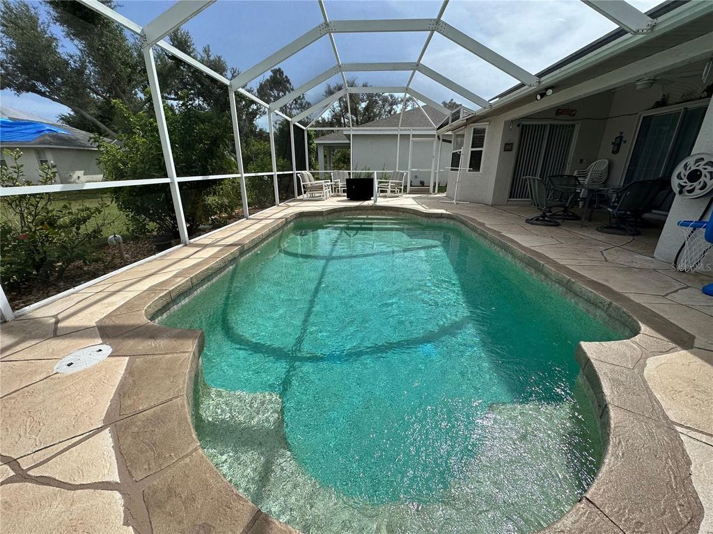 Photo of 107 Cottage Place, Rotonda West, FL 33947 (MLS # D6134019)