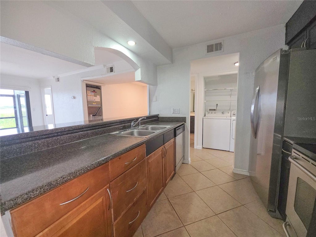 Photo of 10103 Sailwinds Boulevard N #102, Largo, FL 33773 (MLS # TB8561328)