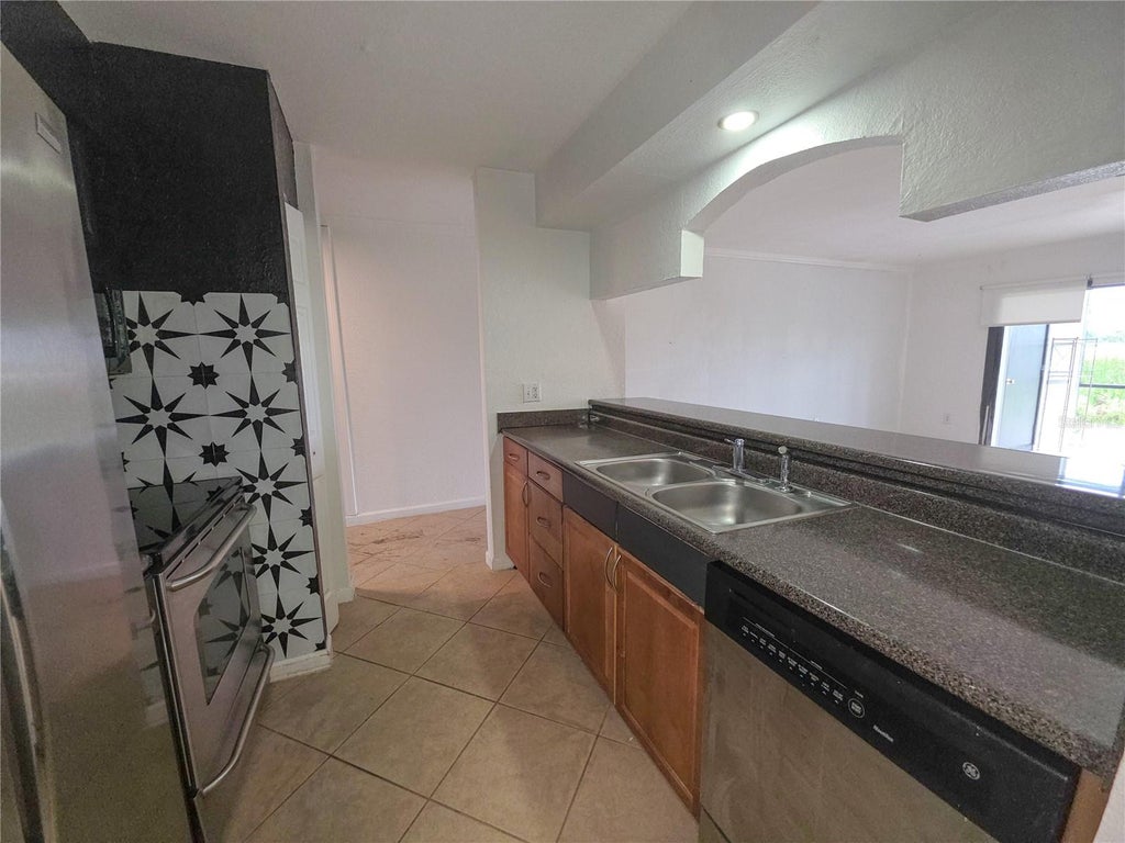 Photo of 10103 Sailwinds Boulevard N #102, Largo, FL 33773 (MLS # TB8561328)