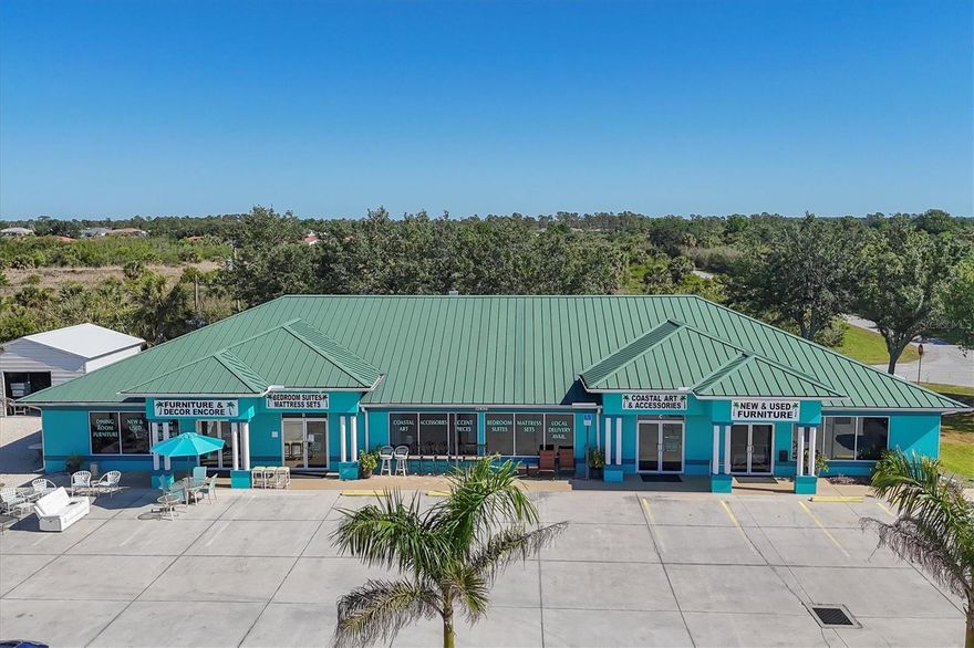 An exceptional opportunity awaits—seller lease-back is an option. This well-maintained commercial property at 12456 North Access Road in Port Charlotte offers both flexibility and long-term investment potential. Built in 2006, the expansive 5,916-square-foot building sits on 0.93 acres and includes four separately metered units, currently leased to the thriving business Furniture & Décor Encore. The property spans multiple parcels, with the main structure on three lots, a spacious parking area, and two additional lots housing 20-by-20 commercial sheds installed in 2023 on concrete slabs.



Zoned Commercial General, the site offers operational versatility for a wide range of commercial uses. Features include five bathrooms, block construction, a slab foundation, a metal roof, and a parking lot with ample space. Located directly in front of a newly approved 297-unit multifamily development, the property is ideally positioned for increased exposure and future growth.
The sale includes real estate only. The business is being sold separately—see MLS D6141946 (New & Used Furniture). Related businesses are also available under MLS D6142631 (Outdoor Furniture & Décor) and D6142629 (New Furniture). A bundled deal may be considered for qualified buyers.