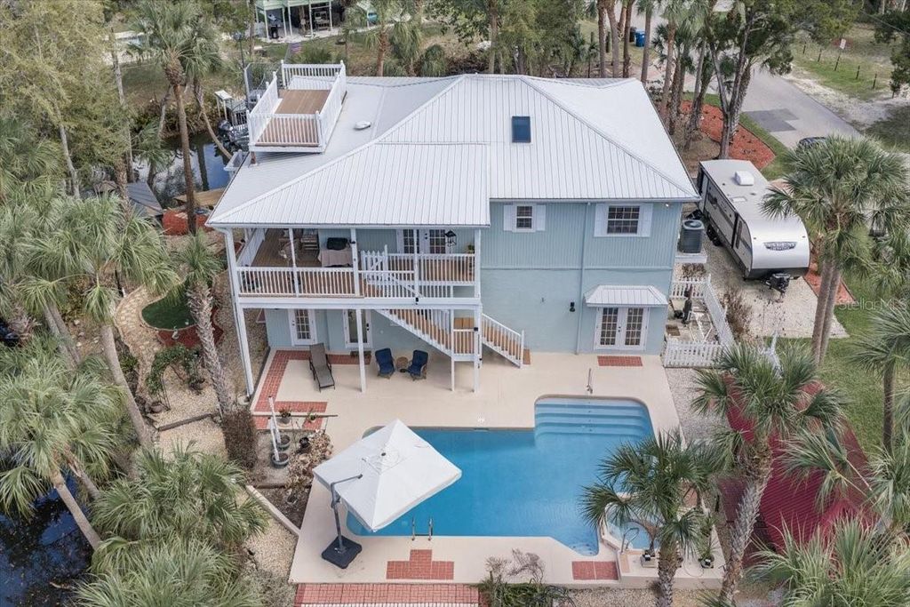 Photo of 6093 Avenue Of The Palms, Weeki Wachee, FL 34607 (MLS # TB8485065)