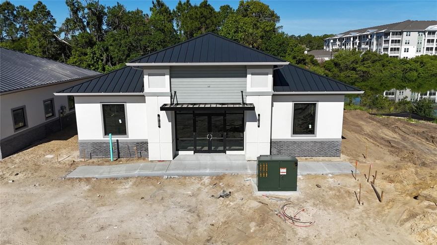 Under Construction. Building #05 is available for purchase at Palm Coast Town Center Exchange, a premier commercial development within Palm Coast’s Town Center master plan and part of a U.S. HUD opportunity zone. The zone boasts tax benefits for owners that participate in the program. The building is being delivered in dark gray shell condition offering a fully customizable interior, giving buyers complete flexibility to design their ideal layout. Strategically located just 0.3 miles in front of AdventHealth Palm Coast Hospital, off Interstate 95 and Highway 100, it boasts prime visibility and access along Town Center Boulevard with over 390 feet of frontage. Nestled in the thriving Town Center community, with multiple residential projects underway, this property is ideal for medical practices and businesses aiming to capitalize on one of Florida’s fastest-growing cities. Contact us for pricing, builder incentives, and to schedule a tour of this outstanding commercial opportunity.