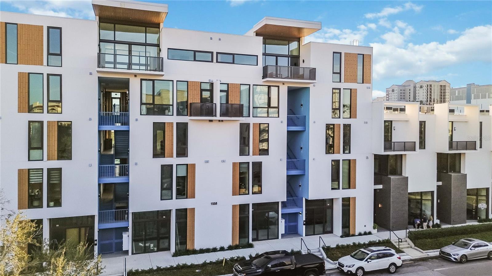 Welcome to Unit 208 at Zahrada 2, a stunning contemporary condo designed by award-winning architects Halflants + Pichette, located in the vibrant Rosemary District. With restaurants, art galleries, Sarasota Ballet, the Saturday farmers market, public trolley, and Whole Foods just steps away, this is the perfect location to experience the best of Sarasota. The nearby public trolley provides easy access to Sarasota’s most famous beaches, making it effortless to enjoy the sun and sand.
This unique split-level, two-bedroom loft unit features ceilings up to 12 feet high, creating an expansive, airy feel. A striking wall of glass brightens the living room, dining area, and master bedroom. The chef-inspired kitchen boasts recessed lighting, European cabinetry with soft-close drawers and under-counter lighting, quartz countertops with backsplash trim, and a premium Frigidaire stainless steel appliance package.
A true rarity in the heart of downtown Sarasota, the private terrace extends your living space outdoors, offering a peaceful retreat away from the energy of the city. Whether enjoying your morning coffee or unwinding in the evening, this exclusive outdoor sanctuary is a feature rarely found in such a prime location.
The home is fully turnkey, complete with all professionally appointed furnishings, and is fully stocked with dishes, bedsheets, towels, and more, ensuring an easy move-in experience or a hassle-free rental opportunity. Additional features include solid core doors, porcelain tile floors inside and out, impact-resistant windows, secure, covered parking in a gated garage, and an EV charger cable ready for installation in your parking space.
With everything you love just steps away, you might find yourself wondering why you even need a car. Schedule your private showing today and discover the Sarasota lifestyle!