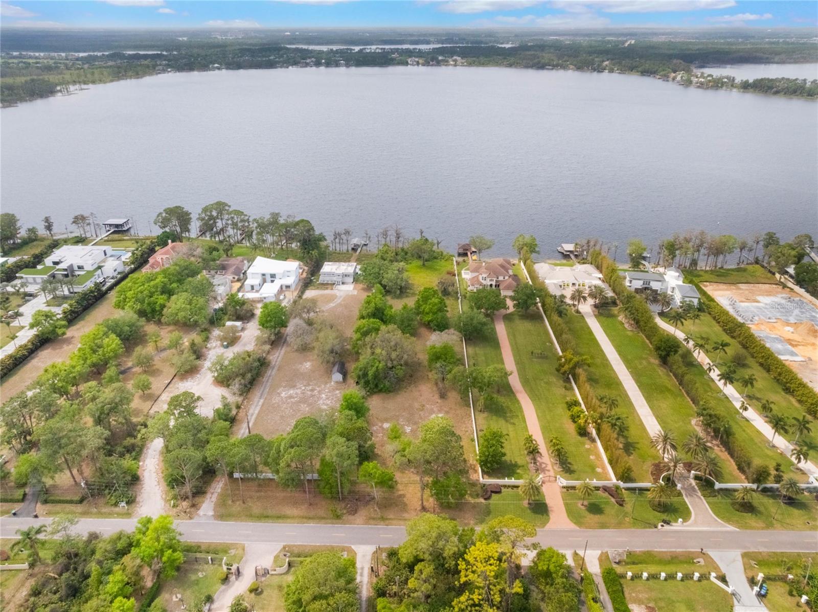 Build your dream home on this expansive 5.86-acre homesite with 129 feet of western-facing shoreline on Lake Sheen, one of the widest lots on Kilgore Road, part of the renowned Butler Chain of Lakes. This listing has two lots, one in the front and one in the back. With over 5,000 acres of pristine waterways, enjoy boating, paddleboarding or kayaking right from your backyard. Evenings will be unforgettable with breathtaking sunset views and Disney's fireworks illuminating the sky. This lot is one of the last remaining opportunities to craft a custom lakefront estate on this iconic street, Millionaire Row, free from HOA restrictions and dues. Choose your builder to bring your vision to life. Prime Southwest Orlando location, on a quiet road with easy access to award-winning restaurants, shopping, major highways and world-class theme parks just minutes away. Lakefront real estate is a rare and timeless investment, don't miss this opportunity to own a piece of Millionaires Row!
<div style="padding:56.25% 0 0 0;position:relative;"><iframe src="https://player.vimeo.com/video/1071611440?badge=0&autopause=0&player_id=0&app_id=58479" frameborder="0" allow="autoplay; fullscreen; picture-in-picture; clipboard-write; encrypted-media" style="position:absolute;top:0;left:0;width:100%;height:100%;" title="9156 Kilgore Road, Orlando, FL 32836 (MLS)"></iframe></div><script src="https://player.vimeo.com/api/player.js"></script>